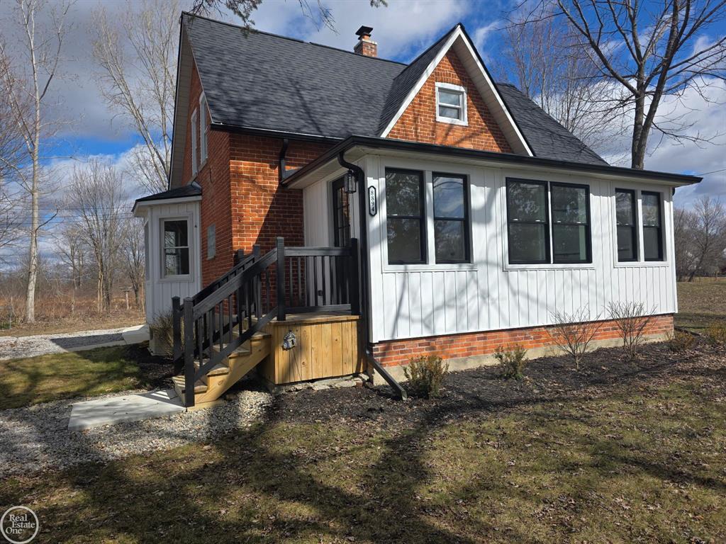 Open house on 3/22 from 1 - 3 pm.  Escape to your own private retreat with 6+acres of serene, wooded beauty-perfect for outdoor living, recreation, and year-round adventure. This beautifully updated split-level home blends farmhouse charm with modern finishes, offering comfort, style, and space for every need. Step into a bright, welcoming foyer with refinished hardwood floors flowing through most of the main level. The brand-new kitchen features soft-close shaker cabinets with 42" uppers and crown molding, granite countertops, stainless steel appliances, and recessed lighting. A flexible room off the kitchen can serve as a formal dining area, home office, or playroom. Convenient first-floor laundry and a fully updated half bath add to the functionality. The spacious primary bedroom offers a large walk-in closet, recessed lighting, ceiling fan, and a stunning new ensuite bath with a dual-sink granite vanity, relaxing clawfoot tub, and tiled shower with surround. The second level features two generous bedrooms, a loft with new carpet, and a newly updated full bath with a dual-sink vanity, granite counter, and subway-tile shower with stone floor. Enjoy the great room's abundant natural light, bay window, and open layout, or step outside to your new cement patio with outdoor fireplace-perfect for summer evenings under the stars. Extra Buildings for Work &Play! A large barn provides ample workshop space plus a finished bonus room for a home office, hobby space, or guest accommodations. Additional outbuildings are ready to store your outdoor gear, vehicles, or recreational toys. Move-in ready and set for your next adventure-welcome home to the best of country living. Other brand-new updates include: roof, roof sheathing, insulation, furnace and A/C, water heater, septic tank and field, updated electrical, updated plumbing, most windows replaced, vinyl siding, front and side entry stairs and decks. New well and large circular drive with new limestone.