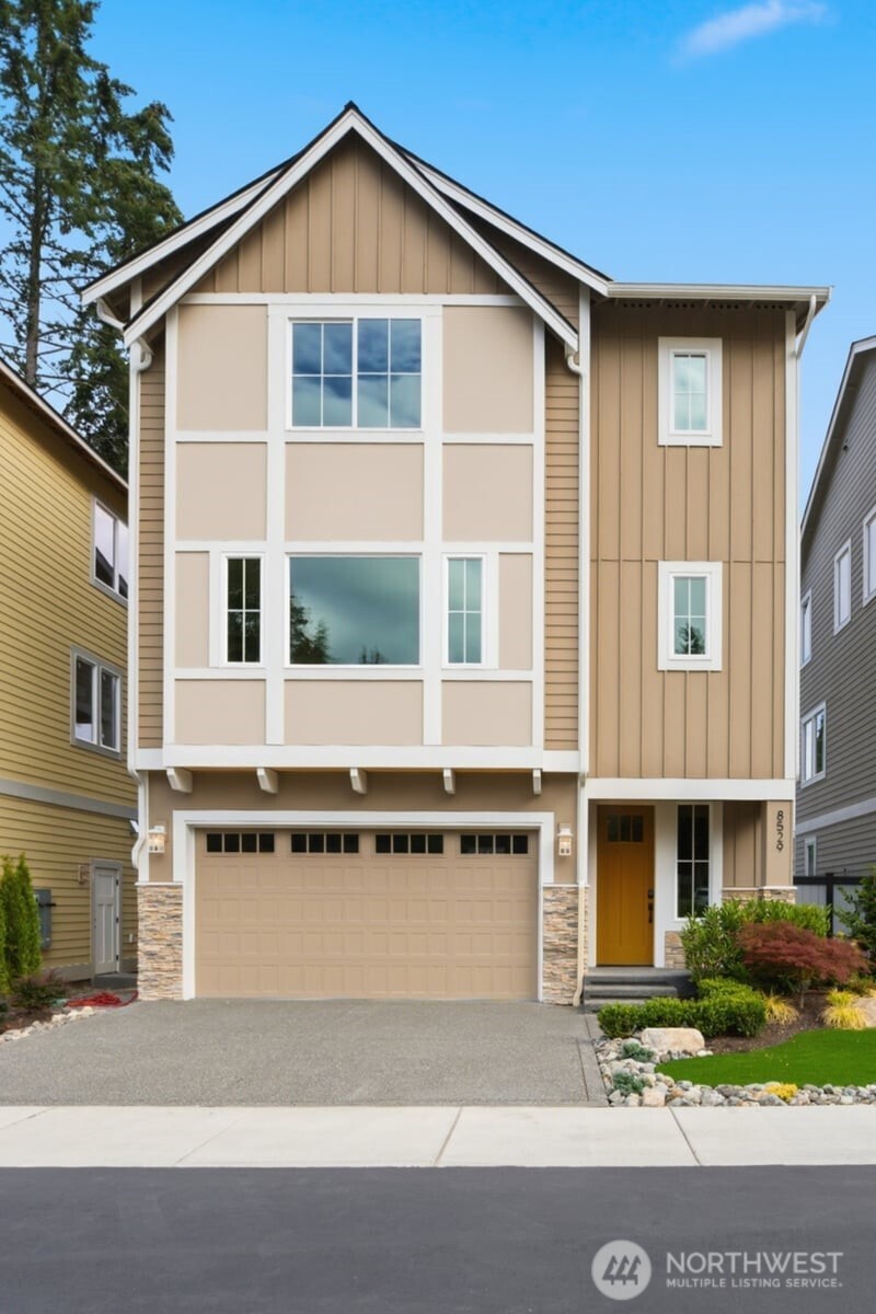 Welcome to Enclave – a new, exclusive gated community in Edmonds.  This craftsman-inspired home is filled with too many amenities and features to list, including 9’ ceilings, custom moldings, paneled walls, built-in beverage coolers, walk-in closets with organizers, two laundry rooms, quartz countertops, custom lit cabinets, and epoxy garage floor. This list goes on and on.    The first floor features a guest suite with its own kitchenette, walk-in closet, bathroom, and laundry room.  The great room on the second floor showcases a large kitchen with high-end Bosch appliances, pantry, electric fireplace flanked with built-in lighted cabinets, breakfast nook/dining area, and French doors leading to a covered deck.     On the top floor, you’re greeted by double doors leading to the primary bedroom with a cathedral ceiling and territorial views.  From there, enter a spa-inspired primary bathroom with soaking tub, heating floor, towel warmer, bidet, skylight, and frameless glass shower.  The top floor has a loft area, two more bedrooms with walk-in closets, the main laundry room, and a second full bath.  Relax and enjoy.