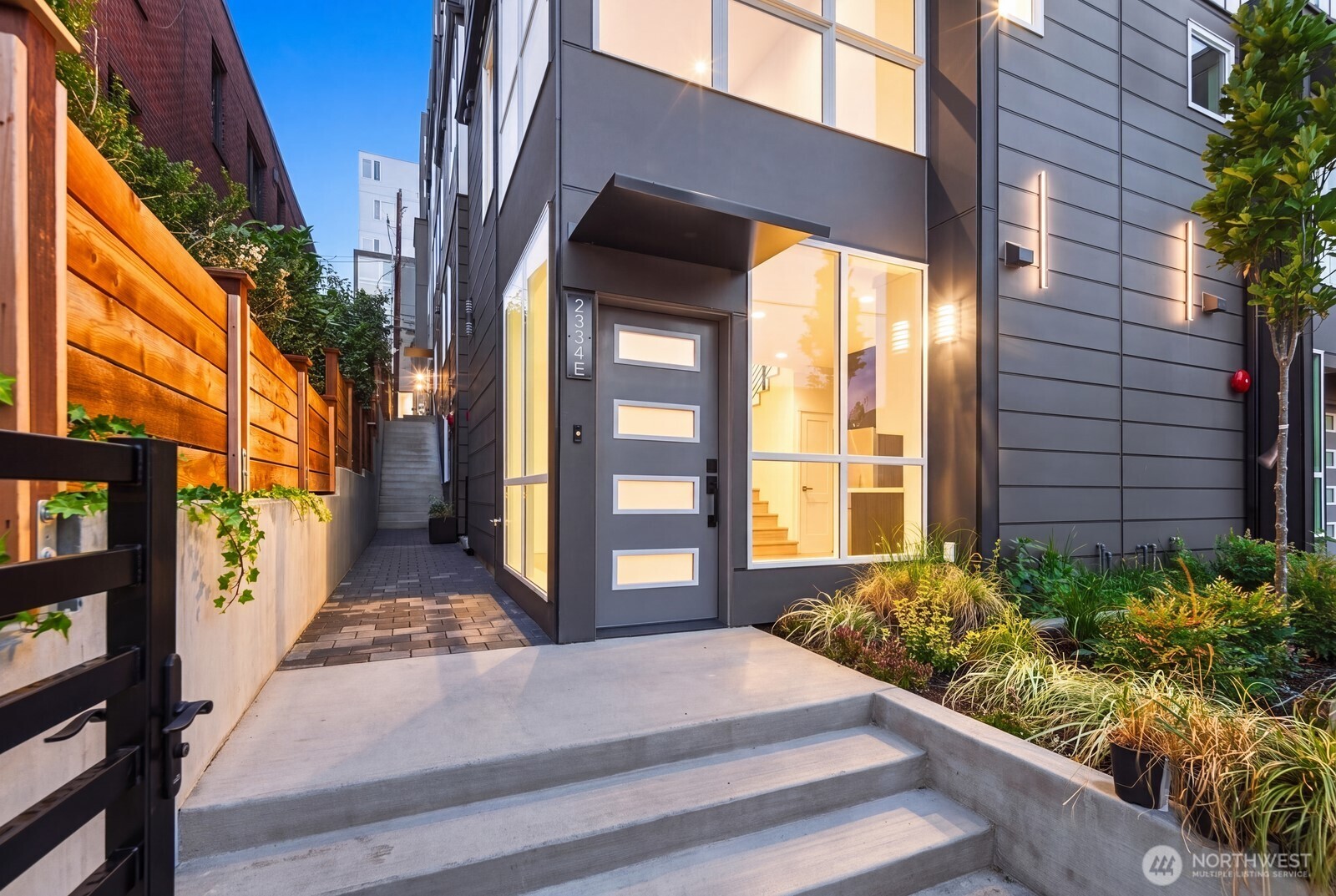 Welcome to the Lifestyle Collection at The Rooftops at Eastlake, one of four distinct new construction townhome layouts in Seattle’s sought-after Eastlake neighborhood. This 4-bedroom, 3-bath residence offers 1,446 SF of thoughtfully designed living plus a 226 SF private rooftop deck with panoramic Lake Union and Seattle skyline views. Designed for effortless everyday living, the entry-level open-concept kitchen, dining, and living area creates a convenient main-floor gathering space with easy access in and out of the home. All four bedrooms are privately positioned on the upper levels, creating exceptional separation between living and sleeping spaces. A spacious guest suite features its own walk-in closet, while the primary suite includes an additional walk-in closet, dual vanity, and beautifully finished bath. Luxury finishes include European frameless cabinetry, floor-to-ceiling kitchen cabinets, quartz countertops, Samsung stainless steel appliances, heated bathroom floors, Toto water closets, designer lighting, and full-home air conditioning. The gated and fenced community offers added privacy and a move-in-ready lifestyle. Minutes from South Lake Union, Downtown Seattle, Capitol Hill, UW, Amazon, Google, Meta, Lake Union waterfront parks, restaurants, coffee shops, shopping, and transit. Ask about our $15,000 builder credit incentive, which may be applied toward a 2-1 interest rate buydown, reduced interest rate of 2% in year one and 1% in year two.