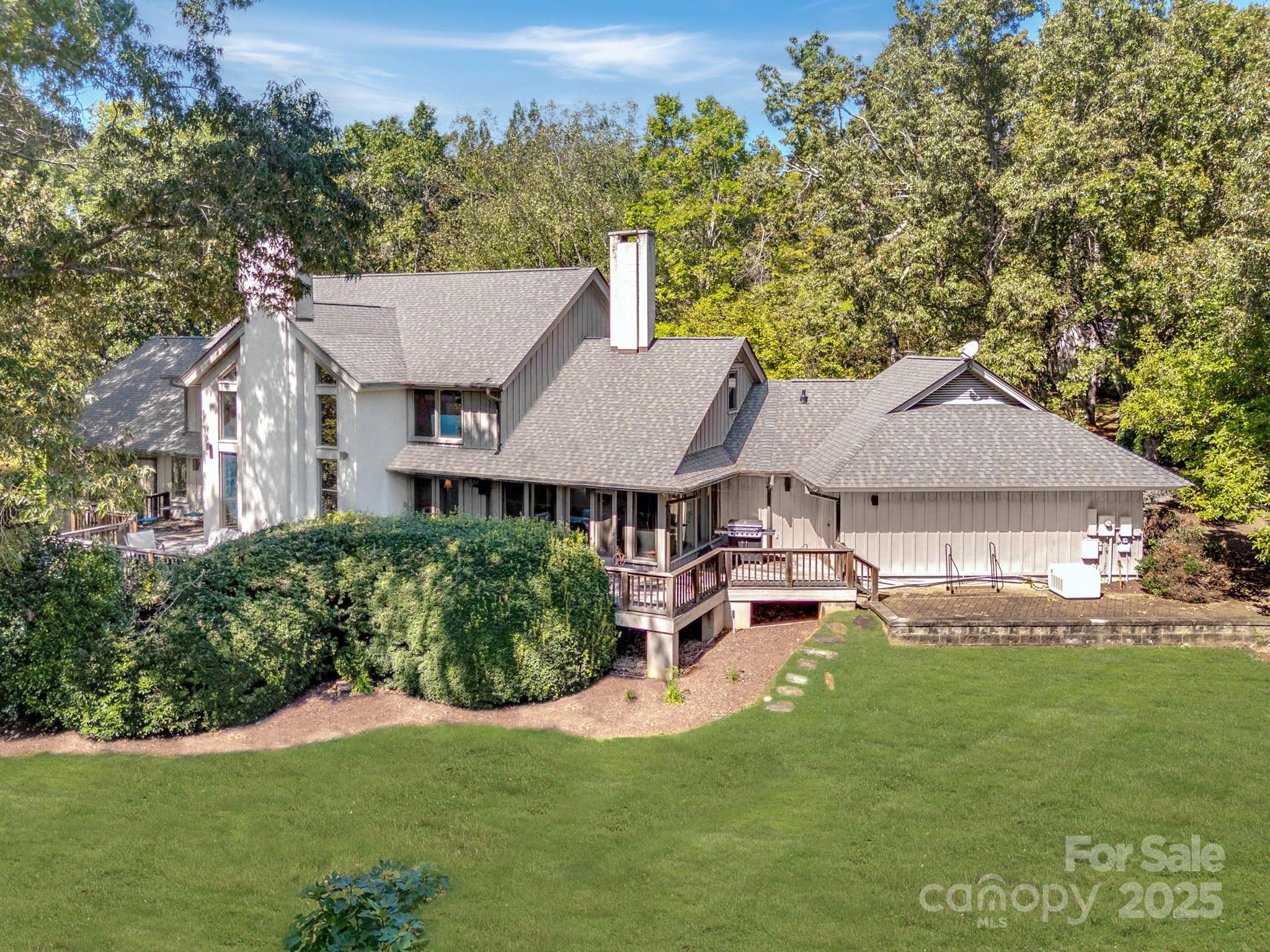 For the buyer who values craftsmanship, privacy, and acreage—this is the one.Set on approximately 20 ± acres, this portion of the estate features a hand-hewn timber-frame home of more than 5,800 square feet, a guest cottage, and a large creek-fed pond surrounded by rolling pasture and mature woods. Nearby, an excavated and leveled building site already has electricity in place—providing the infrastructure for future expansion, whether a barn, studio, or other purpose-built space. The seller is open to offering more or less acreage if desired, allowing the property to fit your vision perfectly.The main home offers three bedrooms, two baths, multiple fireplaces, generator, and an expansive upstairs with additional rooms and loft space—ideal for offices, guest quarters, or creative use. The guest cottage provides comfortable living space with two bedrooms and one bath, perfect for visitors, rental income, or on-site help.Every part of the property has been crafted with intention, offering flexibility and enduring quality. Whether you envision a private retreat, working farm, or equestrian property, this land is ready to support it.A rare opportunity to own a legacy property with the space, quality, and quiet beauty that are hard to find—and even harder to replicate.