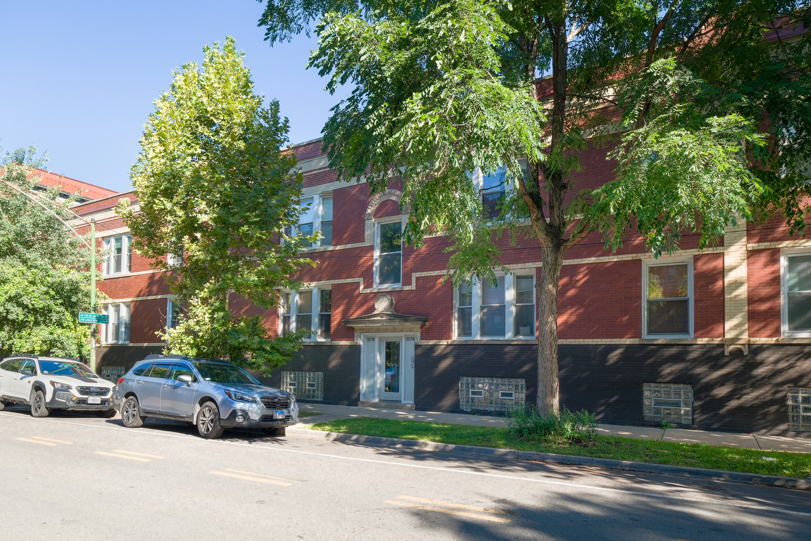 Beautifully updated 2-bedroom, 1-bath condo located in Logan Square, close to the Blue Line, Logan Boulevard, Bucktown, and I-94. This modern home features brand-new windows (installed in 2024), filling the living space with natural light.  The well-appointed kitchen includes stainless steel appliances, granite countertops, a pantry with roll-out shelves, and custom white shaker cabinets. Additional features include cherry hardwood floors throughout, in-unit laundry (plus additional building laundry), and built-in surround sound. Enjoy a spacious north-facing oversized deck ideal for outdoor living, plus a private basement storage room. Mechanical updates include a 2020 water heater. Parking is convenient with permit parking on Lyndale and guest parking on Rockwell.    This sleek, well-designed condo offers the perfect combination of comfort, convenience, and location.