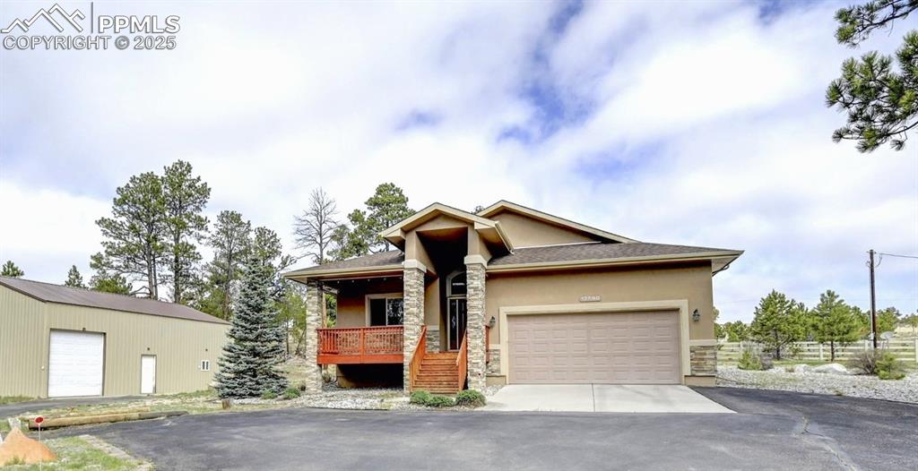 BRAND NEW A/C System! 

Beautiful home in the tranquil area of Black Forest located on 2.34 acres. Getaway from the hustle and bustle of the city while still being close to all the amenities! This stucco ranch floorplan was built in 2015, offers a lovely bright, open floor plan, great room, vaulted ceilings, hardwood floors on the main, large windows and host two fireplaces. The home has a two car garage PLUS the ultimate garage/shop or barn whatever your need is you have the space. Not only is there ample parking but there is an additional room and bathroom with shower.  Additional room and bathroom needs some TLC but is a great space. Plenty of room for cars, an RV and other outdoor toys. This spacious home is perfect for family gatherings inside or out with ample parking in the front. Lovely outdoor patio to enjoy the beautiful Black Forest scenery, land offers trees and open space. This home has the master and additional bedroom on the main with it's own private adjoining bathroom. Large spacious kitchen with walk in pantry, stainless steel appliances and granite,  laundry is also on the main level with an additional 2 bedrooms downstairs. The 4th bedroom is 80% complete but because the property assessor shows three that is what is stipulated in this MLS file.  The lower level of the home offers a huge family room with a beautiful fireplace and plenty of storage room! This is true Colorado living at it's finest! Home is close to parks, Black Forest Section 16 is just a few minutes away, close to hospitals, shopping and the Powers corridor. 
**Septic recently cleaned and inspected**