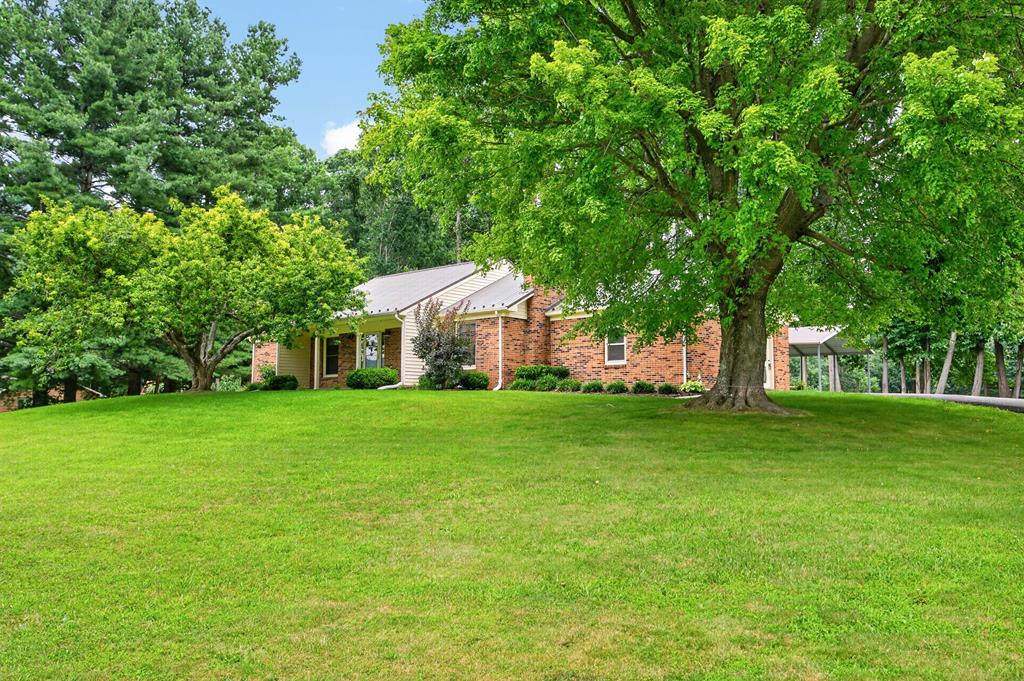Charming brick ranch on a spacious lot — country feel with modern updates. This single-level home offers 3 bedrooms and 2 bathrooms, newer laminate flooring, and a full unfinished basement for future expansion. Recent improvements include a newer metal roof, new heat pump (2023), new paved driveway (2023), and a new garage door on the attached garage. Relax on the covered rear deck to enjoy the peace of country living. A 2-car metal carport, and a new metal storage building (2025) provide plenty of covered parking and storage. Move-in ready with great potential — comfortable ranch living with country charm. Close to the Rural Retreat Lake, schools, and the Appalachian Trail.