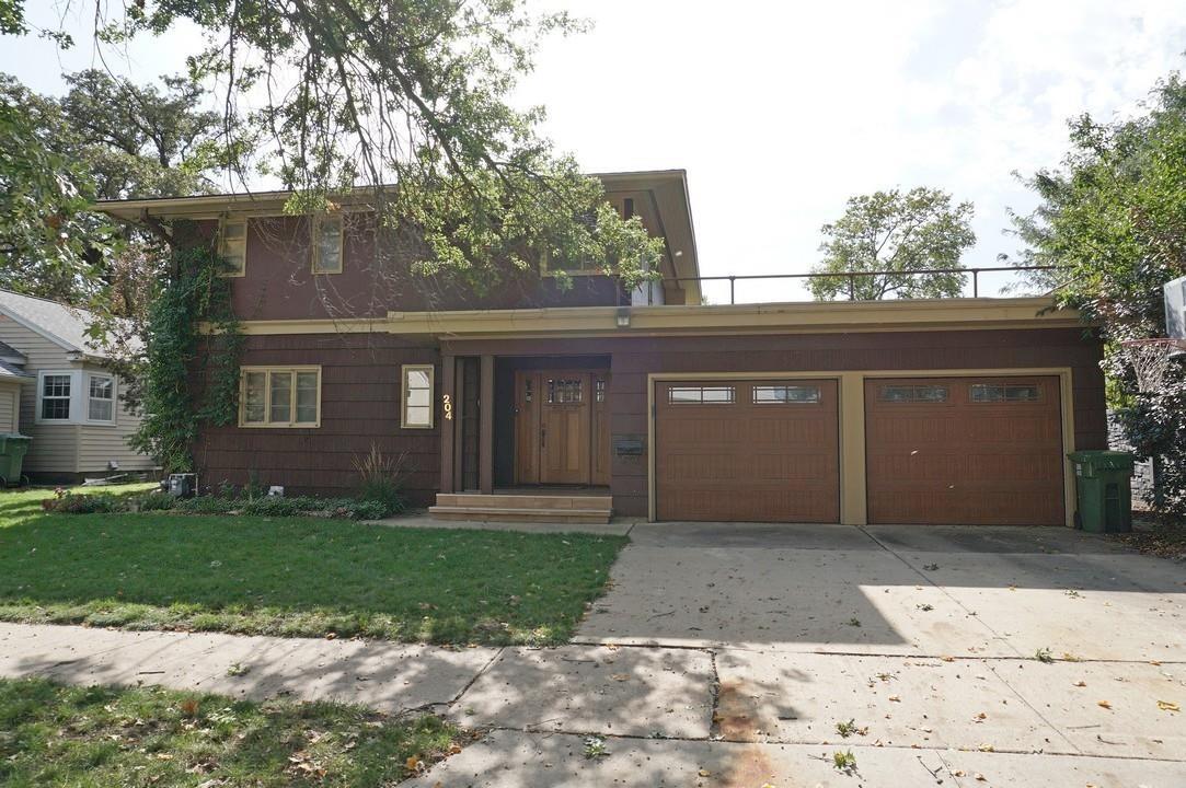 Handsome mid-century home in a picturesque neighborhood, close to parks, recreational trail, and downtown businesses! This timeless home with 2,136 sq ft offers 4 bedrooms and 2.5 baths plus an attached 2-car garage (22 ft x 20 ft) and a private fenced backyard. The main level of the home has a large open living room with a dining area. Sliding doors open to the patio area and backyard. A two-sided brick fireplace creates cozy space in the living room and remodeled main-floor bedroom. The newly built primary bedroom suite features a spa-style bath with soaker tub, custom tile shower, and laundry. The modern kitchen offers ample storage, an island, and a full appliance suite. A main-level half bath is conveniently located off the front foyer. Upstairs offers three spacious bedrooms, a full hall bath and a laundry closet. This house is ready for you to make it your home!
