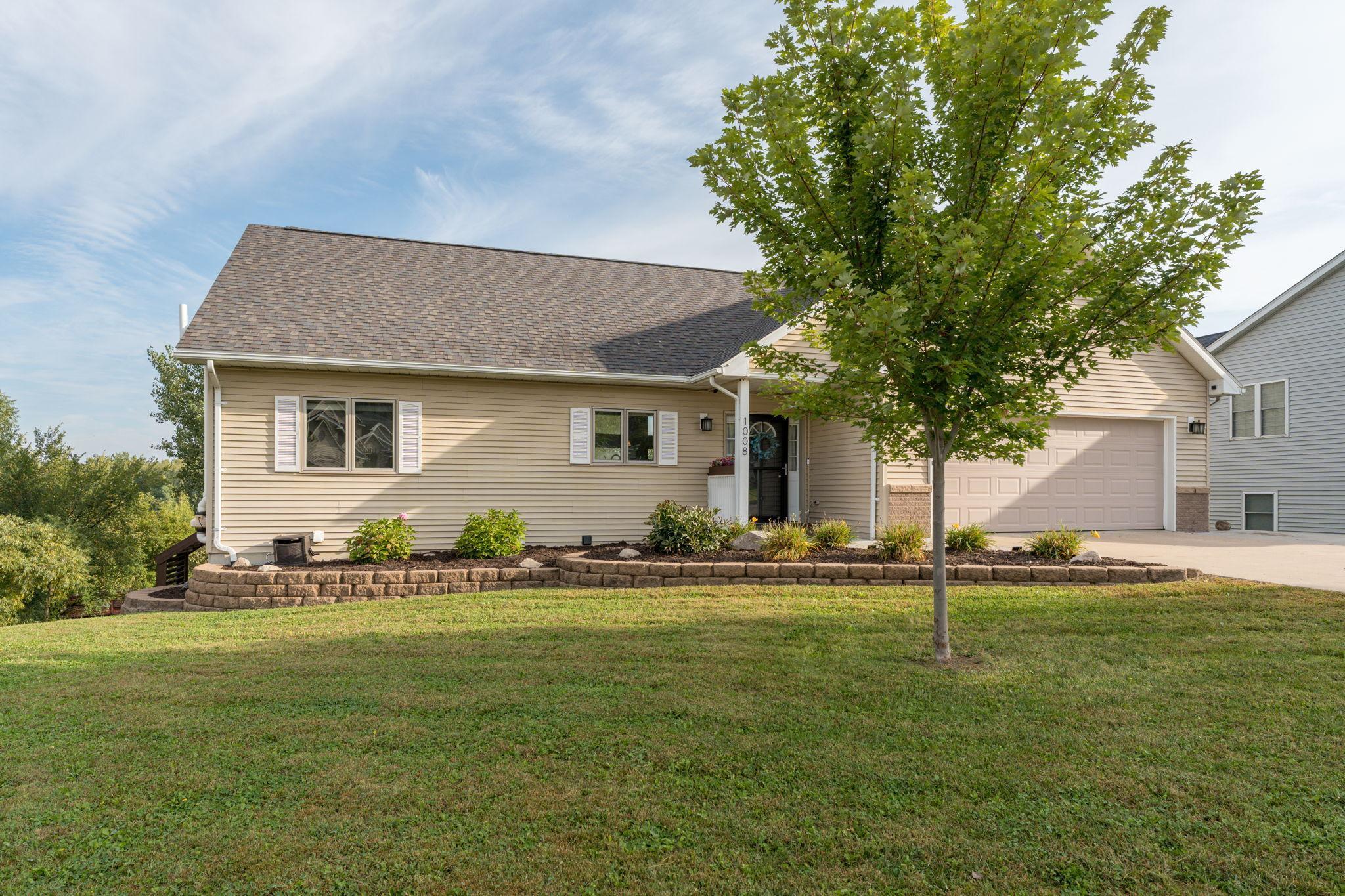 Welcome to this beautifully updated 4-bedroom, 2-bath home located in a cul-de-sac on the outskirts of Belle Plaine, overlooking the scenic Minnesota River Valley. From the moment you arrive, you'll notice the care and attention poured into every detail of this move-in ready property. The spacious layout offers comfort and functionality, while the 3-stall tandem garage provides ample room for vehicles, storage, or a workshop. Step out onto the maintenance free, wrap around deck and enjoy peaceful views of your private backyard with no neighbors behind—an ideal setting for quiet mornings or evening gatherings with views of both sunrises and sunsets. Inside, the home boasts a long list of thoughtful upgrades, including two gas floor-to-ceiling stone fireplaces, a tankless water heater and boiler system installed in 2023, a new air conditioning unit installed in 2020, and major renovations to both bathrooms, including in floor heat. Newer appliances and fresh finishes are complemented by plush new carpet throughout
the home. Additional features include a wet bar and multi-use room on the lower level, heated floors, reverse osmosis water filtration system, garage door opener with battery backup and an added concrete slab beside the garage for extra parking or storage. Every corner of this home has been enhanced with both beauty and practicality in mind. This is more than just a house—it’s a place to call home. Don’t miss your opportunity to experience it for yourself. Schedule your private showing today!