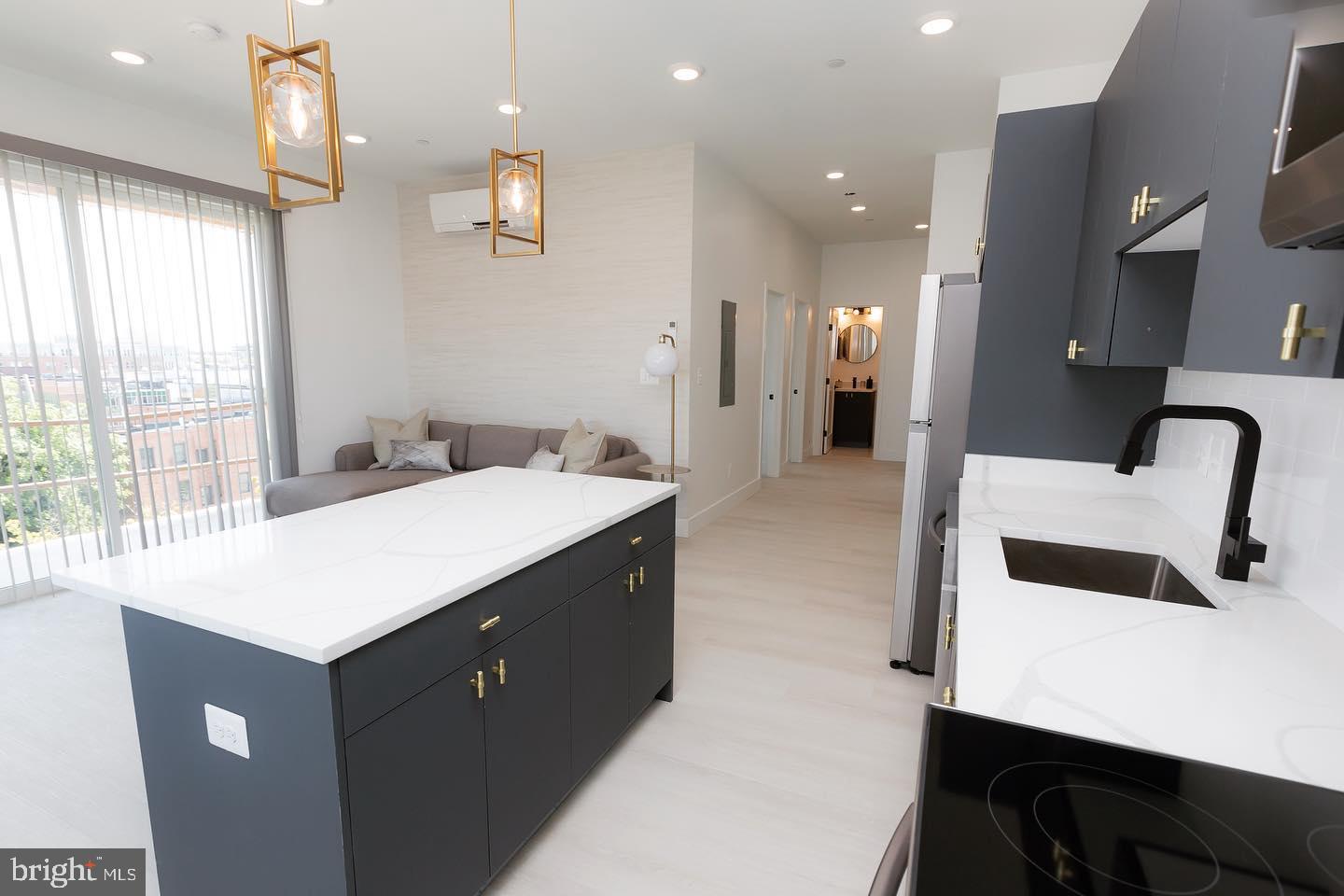 Discover your ideal apartment in The Caroline, where luxury living meets historic charm in the heart of Fells Point. Nestled in this picturesque neighborhood, our stunning apartments offer a refined living experience.Built in 2021, these new apartments step into open floor plans with soaring ceilings, creating an airy, welcoming ambiance that's flooded with natural light. Your gourmet kitchen, adorned with sleek stainless-steel appliances and black matte hardware, will inspire your inner chef. The custom walk-in closets, quartz countertops, engineered hardwood flooring, Philip Jeffries wallpaper, and posh lighting add more than a touch of opulence to your everyday routine as shown in the model home photos.Welcome to Fells Point, where charming cobblestone streets meet the waterfront. This pedestrian-friendly neighborhood boasts an array of bars, top-rated restaurants, and boutique stores. It's also home to one of Baltimore's most luxurious hotels, The Pendry. Explore historic streets, savor a lively culinary scene, and immerse yourself in the rich history and vibrant culture of this unique Baltimore neighborhood. Your oasis at The Caroline awaits, and we are ready to help you find your dream apartment!