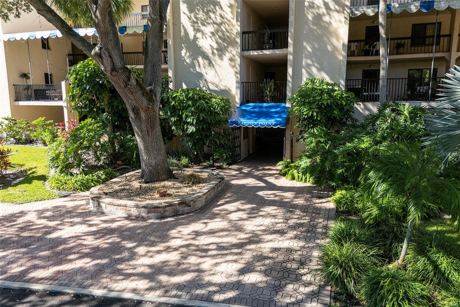 Enjoy the coastal lifestyle in this well-maintained condominium located in the sought-after Tarpon Point Condominiums—just minutes from historic downtown Tarpon Springs, the world-famous Sponge Docks, and the scenic Pinellas Trail.

Step inside to an open-concept living and dining area with sliding glass doors that lead to an enclosed lanai, creating the perfect space for relaxing or entertaining. The kitchen features solid wood cabinetry and includes all appliances, making this home truly move-in ready. Quality flooring and large windows allow plenty of natural light throughout.

This third-floor unit is conveniently equipped with security cameras in the exterior hallway for added peace of mind and comes with an assigned parking space right in front of the building. Community amenities include a refreshing pool, community laundry, and a sun deck overlooking the Gulf of Mexico for the perfect sunset party.

For outdoor enthusiasts, you’ll love the dock with kayak access directly to the Gulf, giving you an easy launch point for your next adventure. Sunset Beach and Fred Howard Park Beach are just a few minutes away, perfect for beach walks or catching breathtaking sunsets.

Whether you’re looking for a year-round residence, winter getaway, or investment opportunity, this condo offers the perfect balance of comfort, convenience, and coastal charm.
