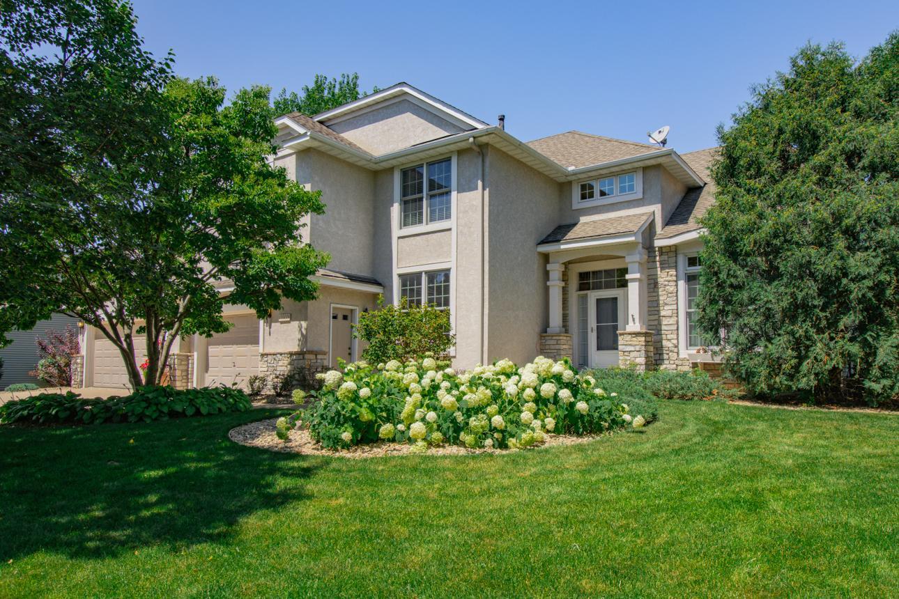 Welcome home to 13939 Ember Way in the Woodwinds development in the heart of Apple Valley! This meticulously cared for, lovingly and thoughtfully maintained property has been owned by one family since its construction in 1998. While its curb appeal draws you in, you’ll be enthralled by what you find when you step inside. Enjoy this six-bedroom home with a split primary, and two additional lower-level flex rooms. A separate lower level entrance from the garage gives guests or other household members easy access to the living space without needing to use the front door. The two-story family room, entry and living room give it a grand, spacious quality. A large granite island in your open concept kitchen ties together seamlessly with the family room featuring a beautiful fireplace, creating a warm, inviting space to relax. Enjoy natural flooring materials throughout the home, including 100% wool carpet, hardwood, and stone to complete the masterful touches of a quality build. A large, maintenance-free Trex deck makes entertaining guests a breeze, and the yard space gives ample room for kids to explore. If you find yourself needing to unwind in nature, you won’t find a better location in Apple Valley! Just a stone’s-throw away lies the Barbara Savanick biking/walking trail system, and just a bit further finds you within the 2,000 acres of Lebanon Hills Regional Park, which includes a lake, ponds and a swimming beach. The Woodwinds development also includes a well-maintained playground, tennis courts and gazebo for residential use, and you’ll enjoy seasonal events throughout the year. The home is within the coveted ISD-196 school district, which include Highland Elementary School, Falcon Ridge Middle School, and Eastview Senior High School, all accessible within a mile of the home. Feel secure with an on-site SLH Home Systems security system. Whether you're a growing family looking for more space, or you’re just ready for your next chapter, 13939 Ember Way is a place you'll be proud to call home. Don't miss this opportunity to own a stunning move-in-ready property in one of Apple Valley's most sought-after communities. One-year HSA warranty included with the purchase of this home!