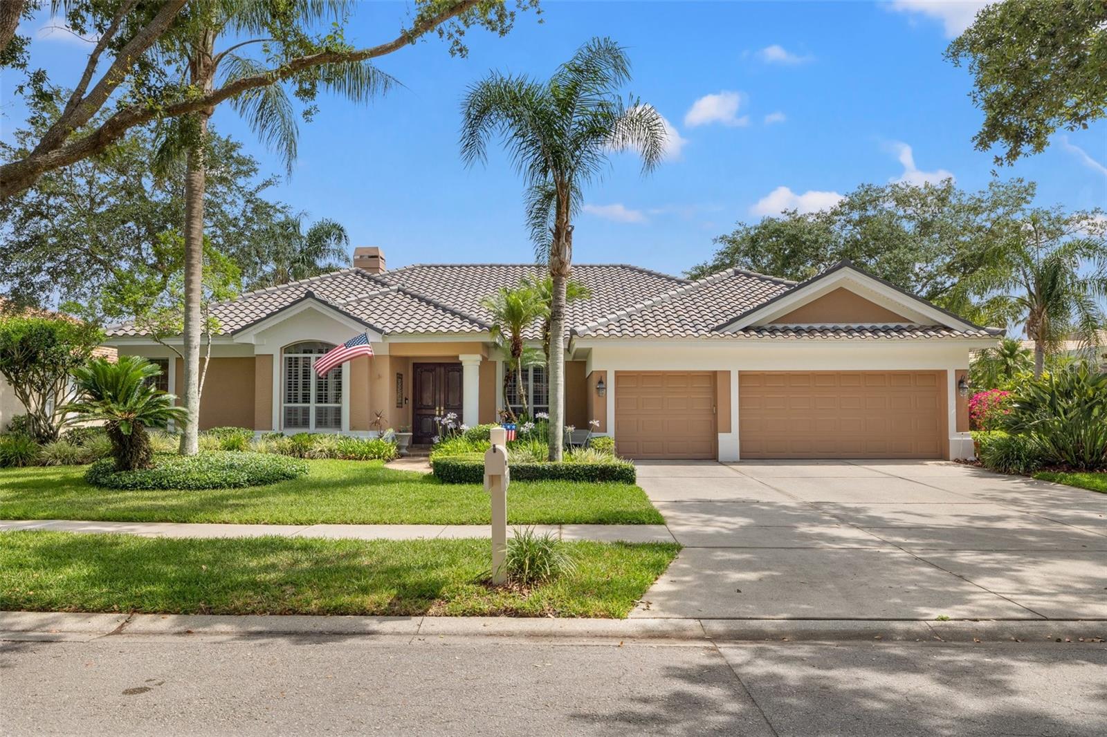Welcome to this beautifully updated one-story pool home in the exclusive, 24 hour guard/gated community of Hunter’s Green Country Club. This spacious home offers 4 bedrooms, 3.5 bathrooms, a dedicated office, and a versatile bonus room that can easily serve as a 5th bedroom. Set on a premium lot within the gated subdivision of Deer Creek, there are serene views of the 15th hole of the golf course and a tranquil pond. The property combines luxury, privacy, and natural beauty with frequent visits from deer, turtles, and a variety of beautiful birds. The home has been thoughtfully upgraded, including a brand-new tile roof completed in 2025, fresh exterior trim paint, a newly refinished pool with updated tile and LED lighting, and a lanai that was rescreened in 2020. Inside, the beautiful kitchen serves as the heart of the home, featuring a large island with a built-in cooktop, upgraded backsplash and hardware, and abundant cabinet space—perfect for entertaining or everyday living. The spacious primary suite offers a peaceful retreat with a sitting area, spa-like bathroom including dual vanities, a garden tub, and a walk-in shower, along with a hot water booster system for instant hot water. The additional three bedrooms are spacious and has plenty of natural light and comfortable layouts for family or guests, while the large bonus room features sliders to the pool and a charming window bench—ideal for use as an entertainment space, playroom, or generous guest suite. Additional features include plantation shutters, beautiful sliding doors throughout, ceiling fans in every room, and a new water heater installed in 2020.  Just outside, you'll find a fully equipped outdoor kitchen with a built-in grill, sink, granite countertops, and attractive ledger stone accents, all within the comfort of your screened lanai. The backyard is fully fenced, offering both privacy and the perfect setting to enjoy the Florida lifestyle. This exceptional home is located in one of Tampa’s most desirable communities, where golf, tennis, and country club amenities are all at your fingertips. The community boasts an array of amenities, including designated bike lanes, playgrounds, well-lit sports facilities for tennis, pickleball, basketball, volleyball, soccer, and baseball, as well as a jogging trail with a 15-station exercise circuit and an off-leash dog park. Additionally, you have the option to elevate your lifestyle with a separate membership at the esteemed Hunter's Green Country Club, granting access to an 18-Hole Tom Fazio designed golf course and privileges at their Tennis and Athletic Center as well as Social Events like the Vintiner's Club. Adjacent to the property, Flatwoods Nature Park beckons with a 7-mile loop for biking, hiking, and bird watching, adding to the abundance of recreational opportunities. Hunter's Green offers easy access to I-75, Moffitt Cancer Center, Advent Health, Bay Care Hospital, USF, premier shopping at The Shops at Wiregrass, and the upscale Prime Outlet Mall.
