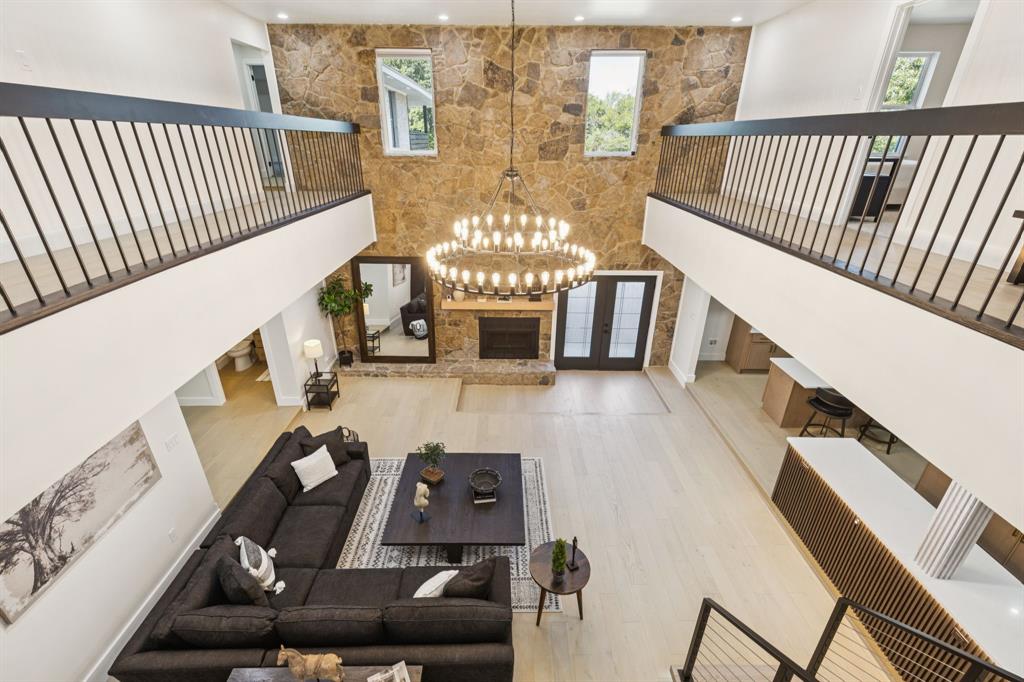 Come Join us for Open House Saturday November 8th 11a-1p!!
Experience refined living in this extraordinary North Texas residence, recently remodeled to showcase modern elegance, lasting quality and innovation with hidden features waiting to be discovered. Designed with commercial-grade construction, including a rare 4-inch concrete slab on the second floor, this home offers exceptional structural integrity built to withstand the elements while providing timeless sophistication.
Featuring 4 bedrooms, 3.5 baths, and a 2-car attached garage, the property also includes a large carport beneath the balcony and a spacious detached metal garage, ideal for additional vehicles, storage, or a workshop. Located just a half-mile walk from Martin High School, the home combines convenience with luxury.
Inside, the chef’s kitchen is a showpiece with quartz countertops, 2 islands, custom cabinetry, designer lighting, and a generous walk-in pantry. Thoughtful spaces for entertaining include a wine room, wet bar, game room, and private movie room. A dedicated office—easily converted into a 5th bedroom—adds flexibility, while the illuminated staircase and bespoke finishes highlight the home’s unique character.
The primary suite is a private retreat, complete with a spa-inspired bath and an expansive balcony overlooking the backyard. Outdoors, a fenced pool and large yard offer a serene setting for both relaxation and entertaining. Every detail—from engineered hardwoods and new tile to modern lighting, fixtures, and cabinetry—has been meticulously updated, ensuring a move-in ready home of exceptional quality.