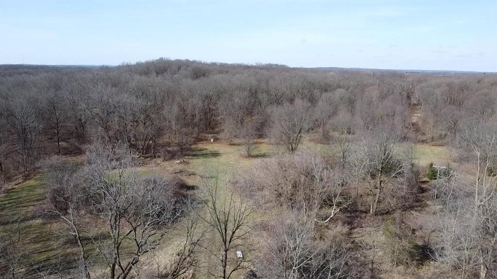 Incredible opportunity to own 156 rolling acres with private road access from Woodland Trail (North) and paved road easement from Hickory Meadows Dr (South). Ideal for development, a private retreat, or a one-of-a-kind recreational property. Bordering over 2,000 acres of public land in Indian Springs Metropark to the east and offering scenic views of Schmitt Lake.Managed for trophy whitetails for over a decade, this property includes established food plots and a well-maintained trail system.Privacy, elevation, wildlife, water views, and unmatched natural beauty-this one has it all.Zoned R1-AIncludes 2 parcels: 07-32-300-007 , 07-32-400-001BATVAI*Maps contained on our sites are there to simply depict the over all layout or shape of a given property and show what it looks like from an aerial view. These maps are neither a legally recorded map, or any type of a legal survey and should never be used as such. Also "Acreage" amounts are displayed as according to the information we have obtained through local government and are in no way guaranteed or warranted to be exact* Current use is Hunting,Recreational,Residential.