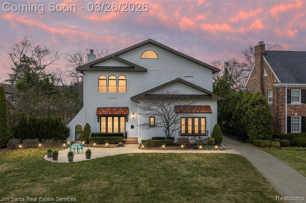 Stunning 4-bedroom, 3-full-bath 1920s Spanish-inspired Colonial in the award-winning Grosse Pointe South School district, blending tremendous architectural character with thoughtful modern updates. Step inside to a Pewabic-tiled entryway, beautiful hardwood floors, detailed plasterwork, high ceilings, leaded-glass doors, and elegant, timeless spaces. The large living room is anchored by a striking gas fireplace with a custom stone surround. The renovated kitchen with flexible breakfast nook offers a clean, stylish aesthetic along with high-end stainless appliances, and an adjacent tiled mudroom for everyday functionality. A spacious first-floor flex bedroom or dedicated home office, paired with a beautifully updated full bath featuring a large tub and shower, provides exceptional versatility. The formal dining room, framed by a curved archway and leaded-glass doors, adds architectural charm. Upstairs, the large primary suite offers remarkable space, vaulted ceilings, abundant natural light, dual walk-in closets, additional storage, and convenient access to the updated HVAC system. The renovated primary bath includes a large shower and dual vanities. Two additional bedrooms and the hallway feature newly refinished hardwood floors (2025) and share a renovated full bath. The freshly painted finished basement adds valuable living space with storage, laundry, and a convenient half bath. Outside, enjoy beautiful landscaping, newer concrete patios (2021), a rare 3-car garage, and a new automatic gated entrance. Major mechanical updates include a new boiler (2025), roof (2014), all 42 windows (2012), updated electrical, and 2 hot water tanks. Residents enjoy exclusive access to Patterson Park and Windmill Pointe Park featuring a private marina, pool, tennis courts, and movie theaters. Truly a standout property offering charm, scale, and modern comfort at every turn.