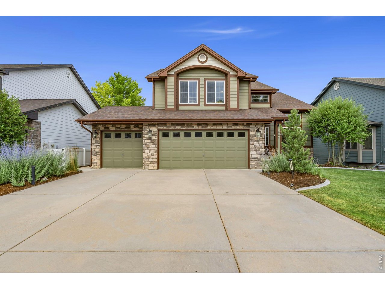 Welcome to this beautifully updated 5-bedroom, 4-bathroom home backing to a greenbelt in sought-after Registry Ridge! Offering 3,442 total square feet of thoughtfully designed living space, this meticulously maintained home blends luxury, comfort, and functionality. Soaring ceilings with exposed beams, abundant natural light, new carpet, brand-new windows with a transferable warranty, and new exterior doors create a bright, inviting atmosphere. The open-concept kitchen features granite countertops, abundant cabinetry, and flows seamlessly into the living room with a cozy fireplace. The spacious primary suite offers vaulted ceilings, a walk-in closet, and a fully remodeled spa-inspired bath with a jetted soaking tub featuring color-changing LED lighting, an oversized marble and river rock shower, and double quartz vanities. Upstairs are three additional bedrooms and an updated full bath with dual sinks. The finished walk-out basement adds a large rec room, fifth bedroom, full bath, and a charming built-in playhouse. Enjoy peaceful evenings on the expansive shaded deck overlooking the greenbelt or relax in the professionally landscaped backyard. Registry Ridge offers miles of trails, parks, open space, a lifeguard-staffed pool, clubhouse, tennis and basketball courts, plus convenient access to shopping, dining, and Horsetooth Reservoir. For added peace of mind, the home has been pre-inspected. This exceptional home offers timeless style, modern updates, generous living spaces, and an outstanding location.
