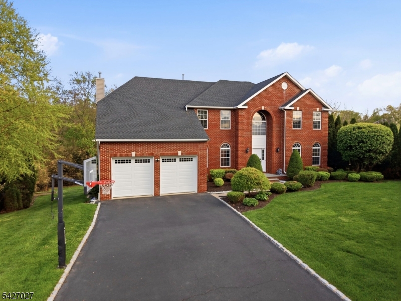 A RARE opportunity to own a ONE-OF-A-KIND home in renowned RIDGEWOOD ESTATE, Monroe! Stunning, fully upgraded 5-bedroom, 4-bath contemporary on a quiet cul-de-sac with premium finishes and modern systems throughout. Bright 2-story foyer opens to an expansive family room and designer kitchen with oversized windows overlooking a private wooded backyard. Expanded chef's kitchen features Wolf & Sub-Zero appliances and a layout ideal for everyday living and entertaining. First floor offers radiant heated floors, plus a bedroom and full bathperfect for guests or flexible living. All bathrooms are fully renovated with upscale finishes and lifetime warranties on faucets and showers. Efficient 2-zone split system with 3 thermostats and whole-house Cat 6 wiring. Walk-out basement adds living and entertaining space with a half kitchen. Additional features include a cedar closet and balcony off the primary bedroom. Outdoor living shines with a covered patio, deck, and built-in kitchen. Highlights: newer roof (4 years), water softener/filtration, owned solar panels, EV charger, and high-efficiency rear storm windows. MOVE-IN READY with exceptional upgrades, open layout, and private setting.