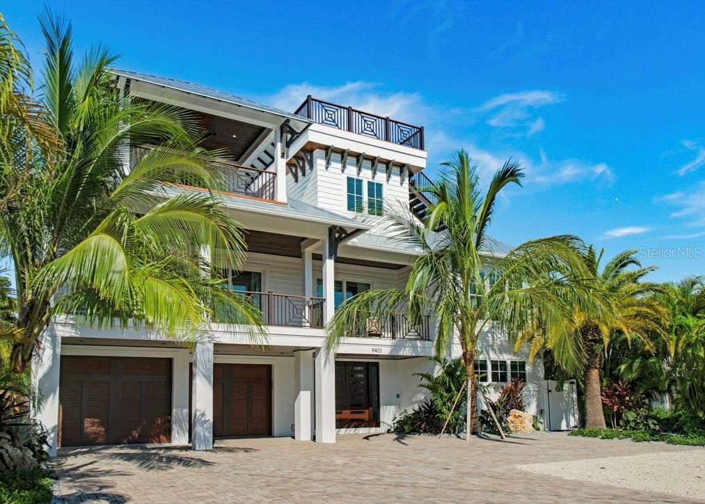 This stunning 9-bedroom, 8.5-bathroom beachfront property offers 3,983 sq ft of heated interior space and comes FULLY FURNISHED with luxurious details throughout. The home boasts an open-concept layout with vibrant living areas, a well-appointed chef’s kitchen, and multiple decks for enjoying ocean views. This home completed in 2020, has a custom private pool with a lazy river-inspired style, a putting green, and a rooftop deck offering 360 water views. Each of the 7 king-sized bedrooms features chic designs, ensuite baths, with many including private balconies. The primary suite includes a large tub, step-in shower, and a private ocean-view balcony. Additional amenities include a convenient elevator, laundry room, and a bar area with a wine fridge. The property’s modern coastal elegance blends perfectly with functional design, creating a space ideal for everyday living or hosting guests- GREAT RENTAL OPPORTUNITY. Located on Anna Maria Island, this home offers beach access and endless opportunities to enjoy the sun and sand. Experience the ultimate blend of luxury and comfort in this meticulously designed coastal haven.