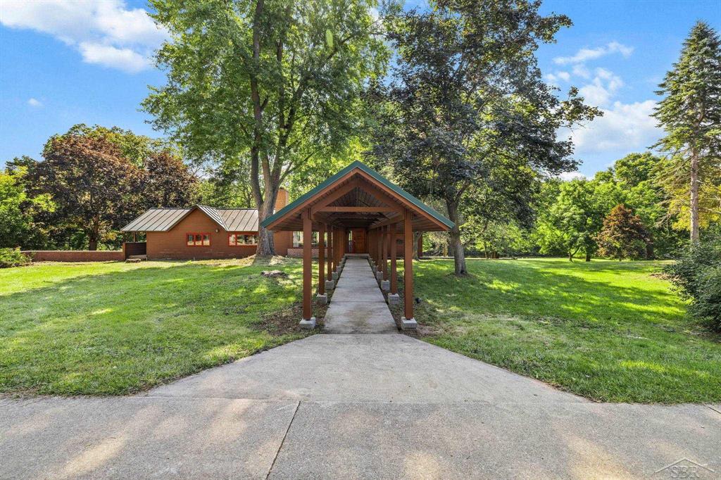 For the first time ever, the historic Anderson/Arbury Farm is being offered for sale-an exceptional property rich in character, history, and opportunity. Situated on approximately 65.4 acres with an incredible 3,750 feet (approx) of frontage on the beautiful Chippewa River, this legacy estate features a Mid-Century Modern home with architectural renovations by Alden B. Dow. The main level of the home offers 1,782 sq ft of living space, complemented by an additional 1,150 sq ft in the finished, walk-out lower level. The home includes two fireplaces, two furnaces, and two AC units, generator, along with an attached two-car garage. Large windows provide stunning views of the river, creating a peaceful and inspiring setting.