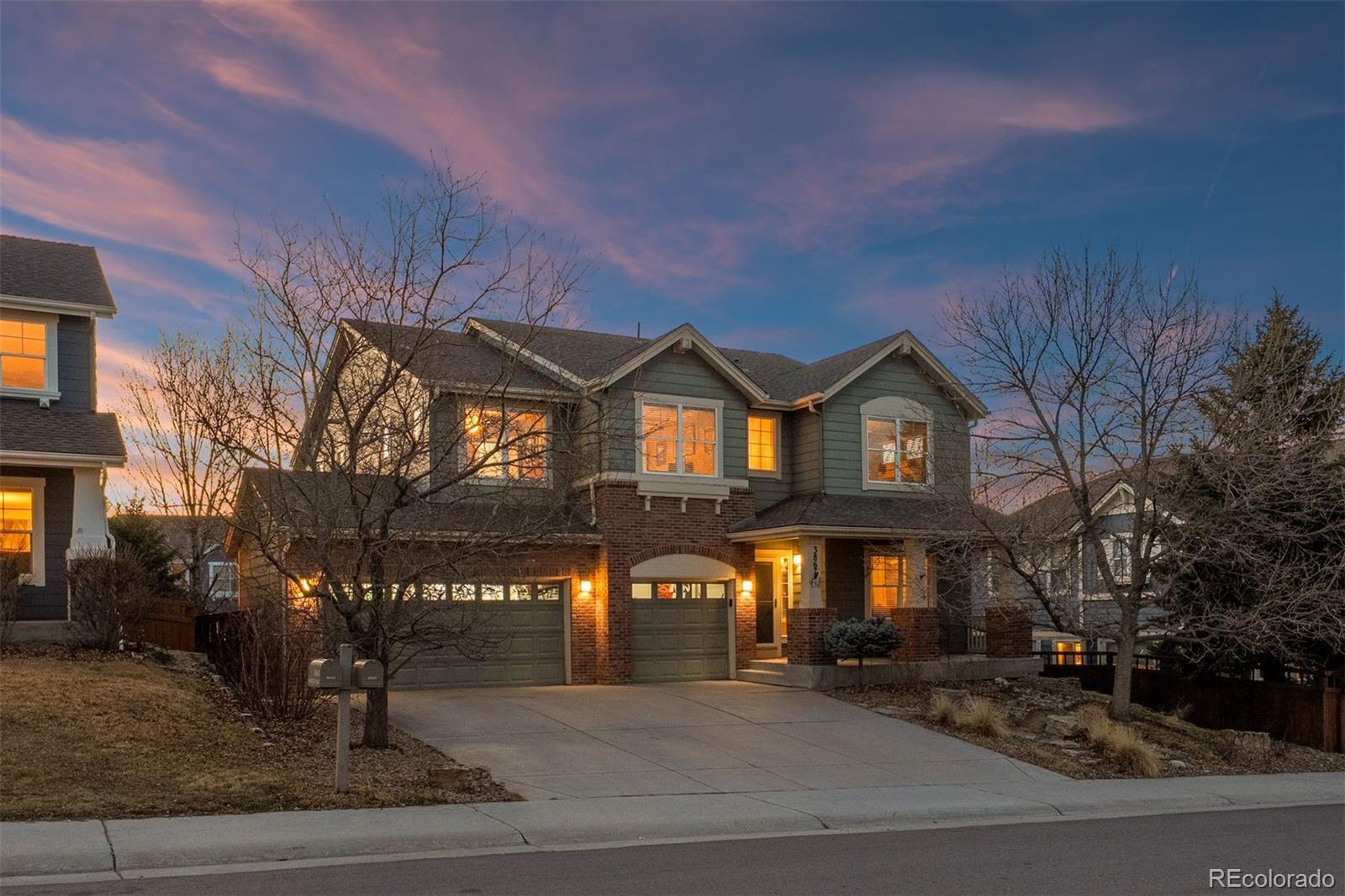 Beautifully remodeled with intention and style, this home in The Meadows blends rustic farmhouse character with modern comfort in one of Castle Rock’s most sought-after neighborhoods. The layout offers space for everyday living and gathering, with four bedrooms on the same level, a dedicated main-level office, a versatile upper loft, and a three-car garage. At the center of the main level, the remodeled kitchen serves as the heart of the home, unfolding just beyond the entry foyer, cozy sitting room, and formal dining area. A large butcher block island anchors the space, extending into breakfast bar seating that connects to the sliding door and deck beyond. Quartz countertops surround the island, complemented by a porcelain farmhouse sink and matching antique farmhouse-style pendant lights. Hardwood floors run throughout the main level and into the dramatic two-story great room, where a gas fireplace and shiplap accent wall add warmth and character beneath soaring 17-foot ceilings. Just off the great room, a dedicated main-level office sits behind French doors, featuring a statement tile accent wall and plenty of space to work from home or manage the day. Upstairs, the primary suite offers vaulted ceilings and views toward the foothills. The ensuite bath provides a quiet place to unwind with a soaking tub, tiled walk-in shower, dual vanities, and a walk-in closet. Three additional bedrooms, each with ceiling fans, share a dual-sink full bath on the same level. Outside, the backyard feels private and serene among mature pine trees. A two-tier extended stamped concrete patio creates space for both outdoor living and dining, surrounded by landscaping. Located in the coveted Meadows community, the home offers easy access to trails, parks, top-rated schools, shopping, and neighborhood pools. This Castle Rock home is ready for its next chapter. Come see it for yourself.