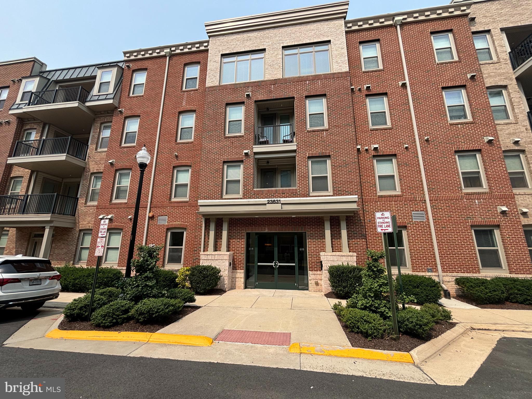 Bright and stunning 2BR/2BA condo with private 1-car garage in the amenity-rich 55-plus community of Birchwood at Brambleton. The inviting kitchen boasts gleaming quartz countertops with subway tile backsplash, stainless-steel appliances, glass pendant lighting, and a spacious island with seating. Head over to the cozy living room that leads out to a spacious balcony with a handy storage closet. Retreat to the master bedroom and take delight in the large walk-in-closet and updated ensuite bath with a sleek, frameless shower and double vanity. The second bedroom is generously-sized and filled with light, making it a perfect home office, craft or guest room. Enjoy living in this vibrant community and all of the incredible amenities it has to offer - indoor and outdoor pools and bars, demonstration kitchen, dedicated spaces for arts & crafts, theater, games, a community garden, a fishing pier, and so much more! Condo fee includes water, trash/recycling, Internet and cable TV (Verizon). Visitor parking available on Gwynevere Alley.