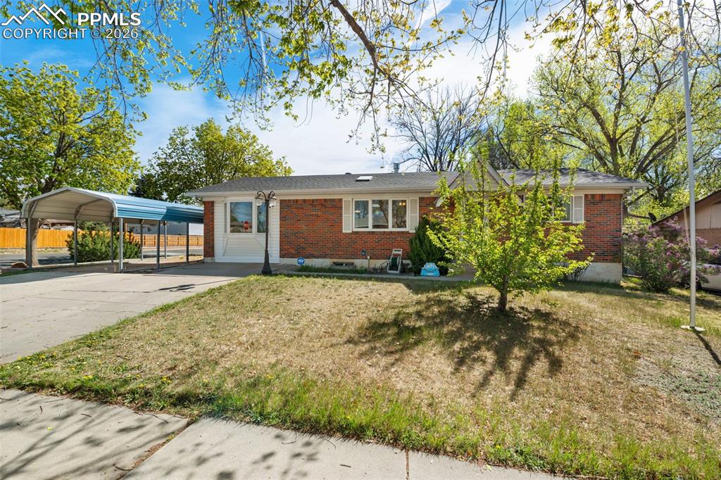Spacious brick rancher situated on a fully fenced corner lot, offering versatility and abundant storage. This 4-bedroom, 2-bath home features an original garage conversion that creates a flexible space ideal for a large dining room, family room, or potential additional bedroom. The main level includes a generously sized primary bedroom with a sitting area, dual closets, and built-in clothing storage, along with a main-level bathroom equipped with a walk-in tub. Natural light fills the home through two skylights located above the living room and breakfast nook.The finished basement provides three additional bedrooms and a bathroom conveniently located near the laundry and storage area. Outdoor amenities abound with a large covered back porch, pergola for outdoor living, a storage shed, and an additional concrete slab perfect for a second shed or workspace. A detached, oversized, heated garage at the rear of the property includes extra cabinetry and a storage closet, making it ideal for hobbies or a workshop. Conveniently located close to shopping, schools, and everyday amenities, this home offers comfort, flexibility, and space both inside and out.