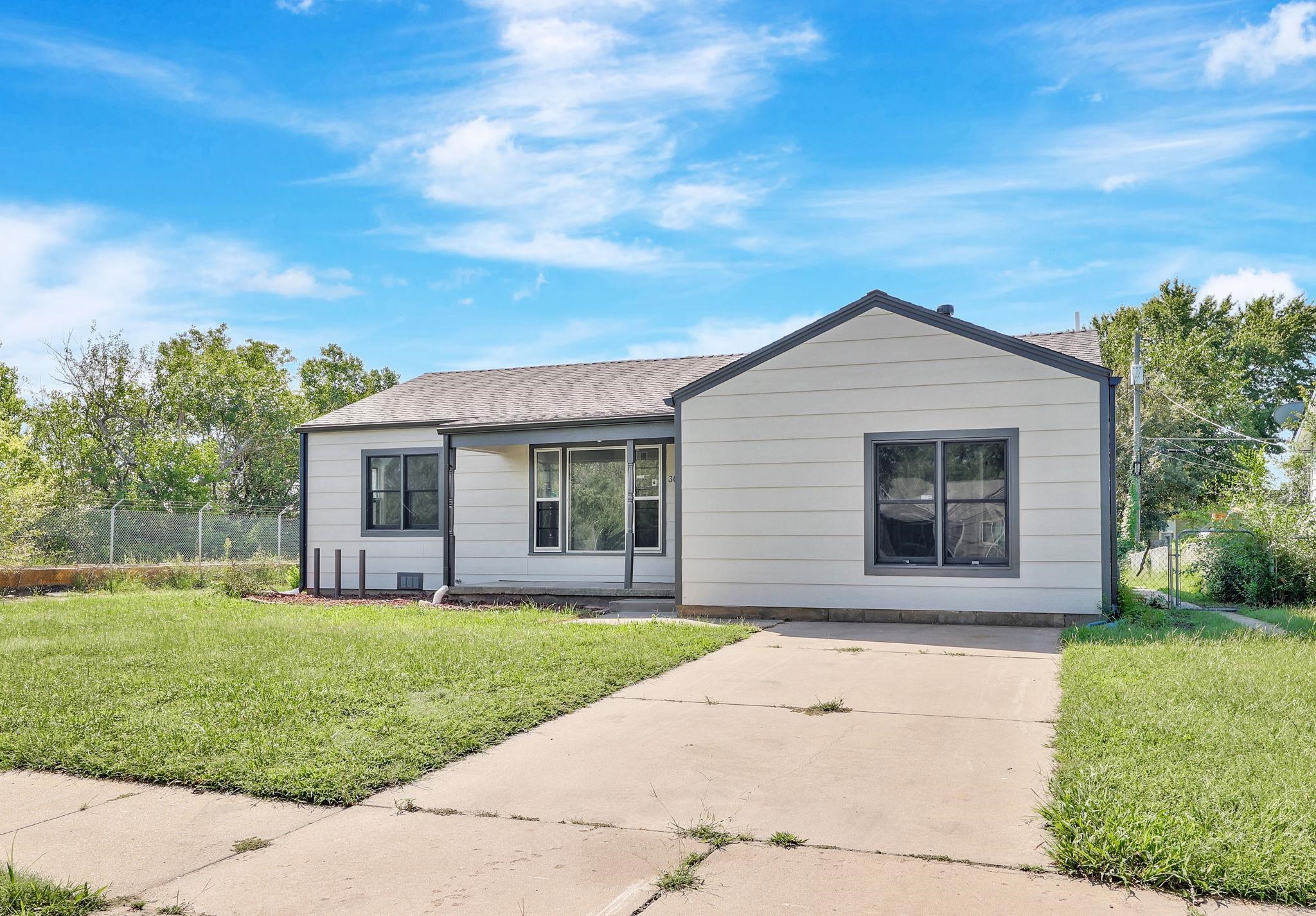 Discover comfortable living in this charming 3-bedroom, 2-bathroom updated home in south Wichita.  This home has been updated throughout.  The roof is new, siding and exterior paint is new along with the guttering.  Inside you will find a spacious floor plan with split bedrooms.  The kitchen features all new cabinets, granite counter tops, back splash tile, and new appliances.  The bathrooms have been totally redone and feature tile showers, new vanities and toilets.  All of the lighting, plumbing fixtures, painting and flooring is all brand new.  If that wasn't enough, check out the 2-car detached garage in the back yard.  You will drive your wheels off looking for a home in this location and price point with this quality of upgrades.  Nothing is left but to move in an enjoy.