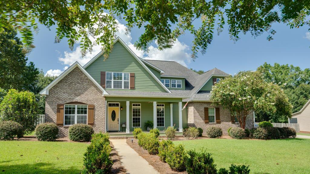 GATED THOMASVILLE LIVING | 4 BEDROOMS + BONUS ROOM | PRIME LOT. Located in Martha's Plantation, one of Thomasville's few gated neighborhoods, this beautifully maintained 4-bedroom, 3-bath home offers space, privacy, and an exceptional location just minutes from downtown Thomasville. Positioned on one of the neighborhood's best lots directly across from the playground, picnic area, and green space, the home features an open kitchen with breakfast bar, spacious living area, formal dining room, and a main-level primary suite with walk-in closet, soaking tub, walk-in shower, and dual vanities. Two additional bedrooms share a Jack-and-Jill bath, while the fourth bedroom is ideal for guests or a home office. Upstairs, a large bonus room offers flexible space for a media room, playroom, gym, game room, or additional sleeping area. Enjoy a landscaped yard, welcoming front porch, screened back porch, and open deck. Convenient to downtown Thomasville, schools, shopping, restaurants, and everyday necessities.