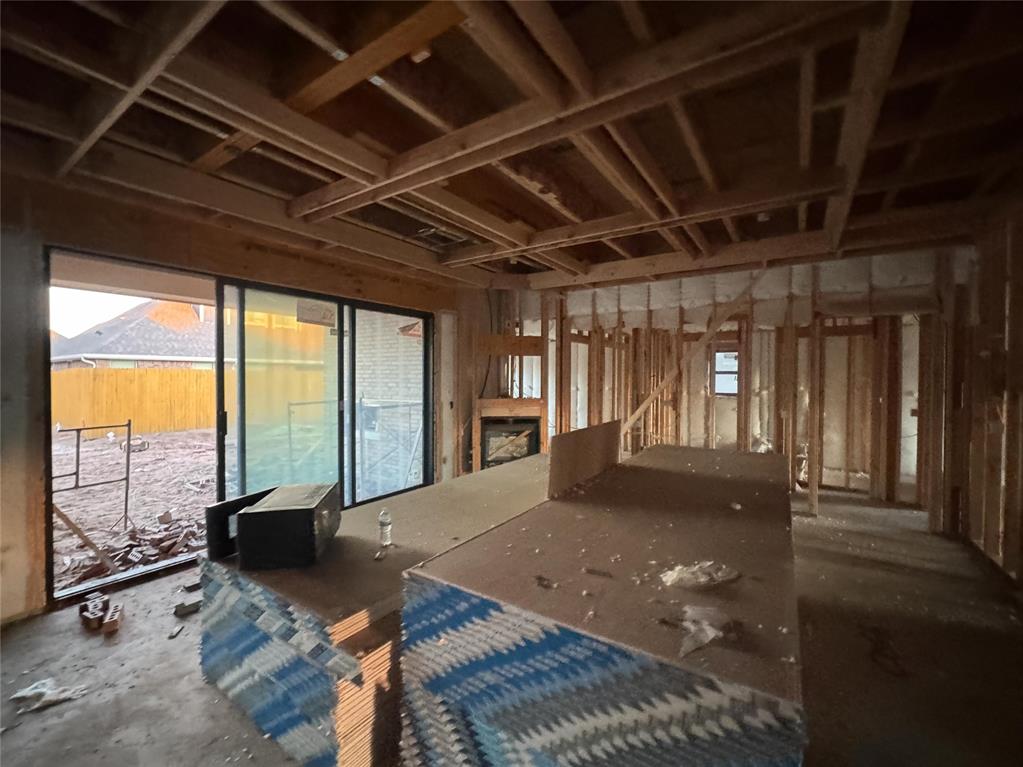 This Hazel Bonus Room 5 Bedroom has 2,735 Sqft of total living space, which includes 2,520 Sqft of indoor living space and 215 Sqft of outdoor living space. This two-story luxury home offers 5 bedrooms, 3 full baths, 2 covered patios, a spacious bonus room, a large utility room featuring a utility sink, and a 3-car garage with an in-ground storm shelter installed. The living room presents a stacked stone corner gas fireplace, a 3-panel sliding door with a 4’ back patio extension, wood-look tile, Cat6 wiring, rocker switches throughout, and an impeccable coffered ceiling with a ceiling fan and crown molding. The kitchen supports stainless steel appliances, including a 5-burner cooktop and double ovens, custom-built cabinets to the ceiling with glass and lights in the uppers, cabinet hardware throughout, 3 CM countertops, stunning pendant lighting, a large corner pantry, modern tile backsplash, and an oversized island with a built-in trash can pullout. The primary suite offers a sloped ceiling with a ceiling fan, windows, and our cozy carpet finish. The prime bath features a dual sink vanity with framed mirrors, a free-standing tub, a walk-in shower, a private water closet, and a HUGE walk-in closet. Covered outdoor living boasts a wood-burning fireplace, a gas line for your grill, and a TV hookup for your flatscreen. This home also offers our healthy home technology, a tankless water heater, a whole home air filtration system, R-44 insulation, and more!