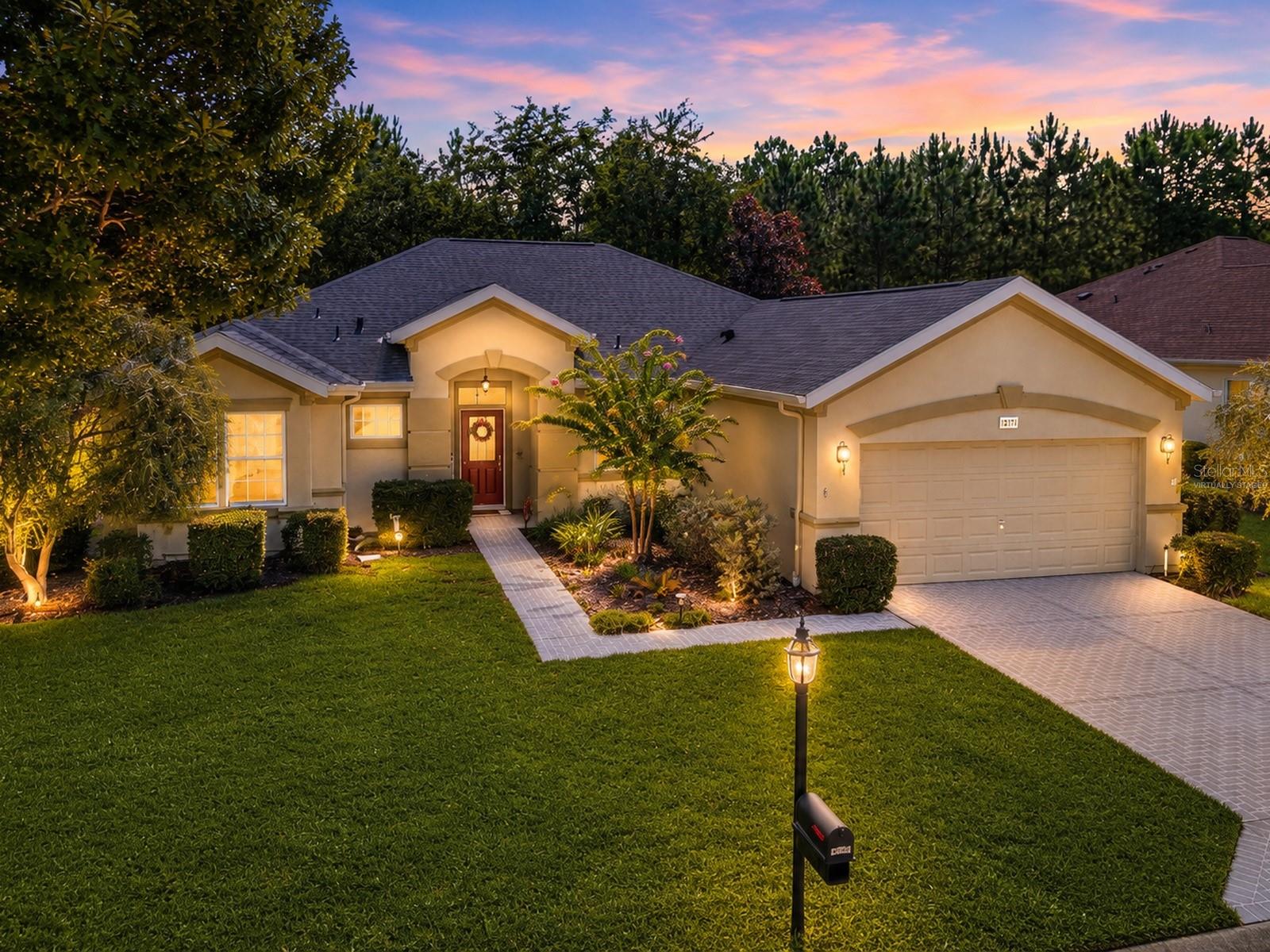 SPRUCE CREEK DEL WEBB | 2 BEDROOMS | 2 BATHS | 2,000+ SQ FT | NO REAR NEIGHBORS | SCREENED LANAI | NO CARPET | GATED GOLF COMMUNITY! THIS IS THE ONE YOU'VE BEEN WAITING FOR! Located in the golf community of Spruce Creek Del Webb in Summerfield, this spacious home delivers the combination buyers are searching for—OVER 2,000 SQ FT, a flexible open floor plan, multiple living spaces, an extended screened lanai, and a peaceful backyard with NO REAR NEIGHBORS! From the moment you arrive, the  maintained exterior, mature landscaping, set the stage for what's inside. Step through the front door into an formal living and dining area featuring HIGH CEILINGS, plantation shutters, and luxury vinyl plank flooring. Even better—NO CARPET!The spacious kitchen sits at the heart of the home and was designed for gathering and entertaining. Featuring stainless steel appliances, abundant cabinetry and counter space, a center island, and additional seating, the kitchen opens to the dinette, family room, and light-filled bonus room, keeping everyone connected while still providing plenty of space to spread out. And don't overlook the BONUS ROOM! Surrounded by windows and filled with natural light, this versatile space could easily become a hobby room, reading retreat, game area, or additional entertaining space. A built-in desk just off the kitchen provides a dedicated workspace and also offers the potential for conversion to an interior laundry/utility room. The guest bedroom conveniently located near the second full bath featuring a tub/shower combination. The spacious primary suite is a true retreat with a beautiful BAY WINDOW overlooking the backyard, walk-in closet, and private bath with walk-in shower. Then step outside—and THIS may become your favorite part of the home! A covered patio flows into an EXTENDED SCREENED LANAI overlooking a tranquil backyard with NO REAR NEIGHBORS. Morning coffee, evening cocktails, entertaining friends, or simply enjoying the Florida weather—this outdoor living space gives you room to enjoy it all. But the home is only part of what makes this opportunity so special. Spruce Creek Del Webb offers an incredible array of amenities and activities, including approximately 70 clubs and interest groups, a full-time activities director, indoor AND outdoor pools, hot tub, pickleball, tennis, bocce ball, shuffleboard, horseshoes, volleyball, softball, billiards, RV storage, and 36 HOLES OF MULTI-TEE CHAMPIONSHIP GOLF! Homes offering THIS MUCH SPACE, NO REAR NEIGHBORS, an EXTENDED SCREENED LANAI, NO CARPET, and access to an amenity-rich gated golf community deserve attention. Don't wait to discover why Spruce Creek Del Webb continues to be a must see! Schedule your private showing and experience this home for yourself!