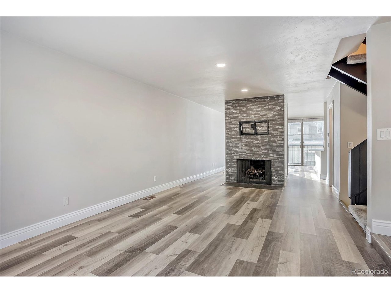 Perfectly positioned in the heart of Capitol Hill, this stylish townhome offers exceptional walkability just moments from Governor's Park, Trader Joe's, neighborhood cafes, restaurants, and everyday conveniences. From the moment you enter, you're welcomed by an open, airy layout designed for both effortless entertaining and comfortable daily living. The main living space flows naturally, creating an inviting atmosphere that feels both functional and refined. Located within a gated community, residents enjoy a sense of privacy along with thoughtfully designed amenities including a sparkling community pool, shared BBQ grills perfect for gathering with friends and neighbors, and beautifully maintained common areas. The HOA provides outstanding value by covering capital reserves, insurance, irrigation water, grounds maintenance, structural maintenance, recycling, sewer, snow removal, trash, and water-allowing for a truly low-maintenance lifestyle. One of the most coveted features for city living, the attached two-car garage offers rare convenience in this central location and has been enhanced with newly installed epoxy flooring, adding a clean, polished finish to the space. Don't miss the large storage room in the basement, providing valuable extra space rarely found in city townhomes. Combining an unbeatable location, desirable community amenities, and modern comforts, this Capitol Hill townhome presents a fantastic opportunity to experience some of Denver's most vibrant living right outside your front door.
