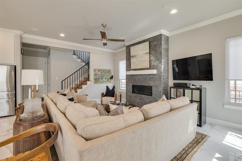 Right off Western Avenue, this masterfully designed 2019 home remains as flawless as the day it was built. A seamless fusion of sophistication and functionality, its open-concept design is elevated by exquisite finishes and meticulous craftsmanship. The gourmet kitchen boasts bespoke cabinetry, striking Cambria quartzite countertops, and premium JennAir appliances, all centered around a grand island designed for effortless entertaining. Sunlight pours into the expansive living and dining areas, where a sleek gas fireplace infuses warmth and ambiance. A well-appointed mudroom and chic powder bath sit just around the corner for added convenience. Upstairs, the primary suite offers a tranquil escape, featuring a private balcony, a spa-like bath with a freestanding soaking tub and a multi-head shower, and a thoughtfully designed walk-in closet. Two additional bedrooms, a sophisticated full bath, a dedicated office nook, and a laundry room complete the second level. Just moments from the lively dining, shopping, and nightlife of The Western District, this home delivers a perfect harmony of contemporary luxury and vibrant city living.