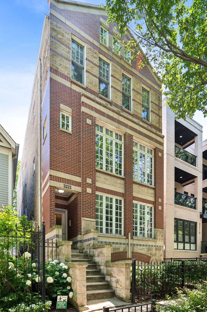 Welcome to this stunning, light-filled top-floor 2 bedroom, 2 bath penthouse in the heart of Lake View. Nestled among the treetops, this bright and spacious home features hardwood floors throughout, soaring vaulted ceilings, and an extra-wide living room that easily accommodates both a dining area and a home office. The open, updated kitchen is equipped with stainless steel appliances, a subway tile backsplash, granite countertops, and abundant cabinet storage. Anchored by a cozy fireplace, the expansive living room offers the perfect setting for both everyday living and entertaining. The king-sized primary suite impresses with vaulted ceilings, a walk-in closet, two additional closets, and a luxurious ensuite marble bath with a double vanity and jacuzzi tub. The versatile second bedroom provides flexibility for guests, a nursery, or a dedicated workspace. Additional highlights include a private back deck, in-unit laundry, extra storage, and a dedicated garage parking space. Ideally located in Lake View, you're just steps from the Southport Corridor, Donahue Park, the Belmont CTA station, and the countless dining, shopping, and nightlife options along Clark, Belmont, Sheffield, and Halsted.