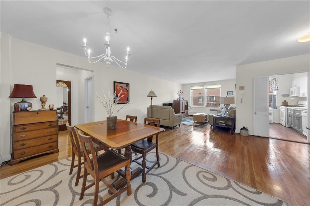 Set on the top floor of one of Bay Ridge’s few 24-hour doorman buildings, this spacious one-bedroom co-op offers approximately 875 square feet, a flexible layout, and partial water views over the treetops from both the living room and bedroom.The entry leads into a generous dining area that flows naturally into the living room, with enough space to create a dedicated home office or dining area. The renovated, windowed galley kitchen includes an eat-in area and luxury vinyl plank flooring. Positioned on the opposite side of the apartment, the large bedroom offers privacy from the main living space and includes a double closet. The partially updated bathroom features a full tub.Additional features include hardwood floors, four closets, through-wall air conditioning, ceiling fans, and overhead lighting throughout the apartment.Known as The Len, 9201 Shore Road is a well-maintained, full-service cooperative with a 24-hour doorman, live-in superintendent, porter staff, recently renovated lobby and entryway, two laundry rooms, a bike room, and Fios availability. Indoor garage parking and private storage are available by waitlist. Shore Road Park is directly outside the building, express bus service stops at the front door, and the R train at 95th Street is nearby.
