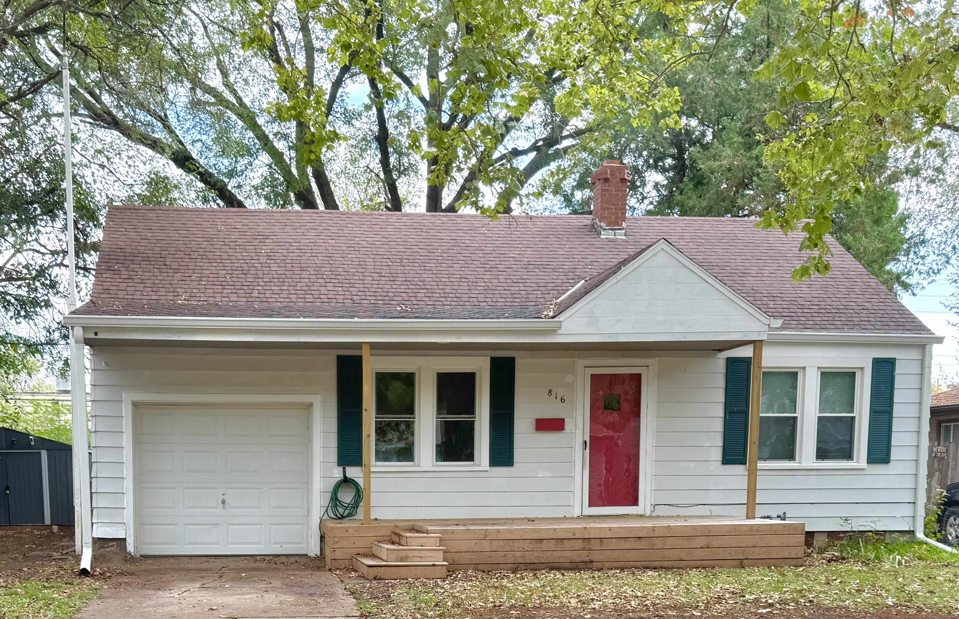 Get excited to see this darling 3 bedroom, 2 bath home with almost 2000 sq, ft. and all of the things to make you want to move right in. Outside you will notice low maintenance steel siding, new windows, a great, big front porch to watch the world go by and attached garage in the front. The spacious, fenced back yard features a patio for entertaining and includes a storage shed for your extra tools and toys. There's plenty to love inside with the living room, kitchen, diningroom, 2 bedrooms, laundry, full bath and sunroom all on the main level. The master bedroom is privately located on the upper level of the house with a walk in closet and a built in chest o' drawers, too! The cute kitchen has been recently updated with modern cabinets, stainless sink, wood counter tops and all of the appliance stay with the home - even the washer and dryer. You will fall in love with the fully enclosed sunroom! Downstairs is another full bath, a non conforming bedroom, family room and a storage room. The seller just finished out the family room in the basement December 8th - great improvement! This basement is DRY with recent waterproffing done by Thrasher including a french drain system. The recent upgrades of central heat and air, new windows and the Thrasher basement waterproofing all have transferrable warranties for your confidence in this great home. Come see this one before it slips away!