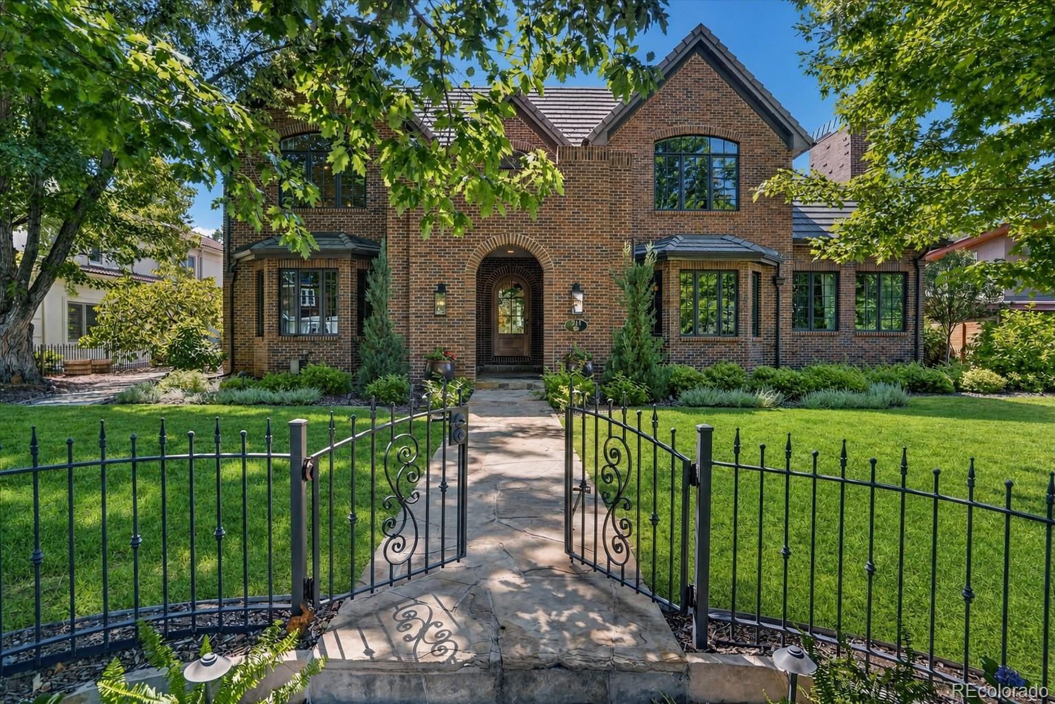 This spectacular home is a rare find in one of Denver's most sought-after neighborhoods. The home was completely updated with over $300,000 in improvements prior to the current sellers, with additional improvements since taking ownership. It offers everything today's lifestyle demands, from entertaining to working from home to fitness and play. A striking new front door, new lighting fixtures and a refreshed front balcony flooring set the tone the moment you arrive, adding fresh architectural character to this home filled with light. The kitchen was updated with dual dishwashers, a Viking refrigerator, Brazilian quartz counters, and a beverage center opening seamlessly to the huge family room. A floor to ceiling temperature controlled wine wall connects the kitchen to the banquet sized dining room. Two additional main level rooms offer flexibility as an office, study, library, or formal living room, each with its own fireplace and beautiful architectural detailing. The primary suite is a sanctuary with a separate sitting room, office, or studio, two custom closets, and heated floors in the renovated bath. The lower level features soaring 10 to 11 foot ceilings and 8 foot doors, and the playroom and game room feature a wet bar with beverage refrigerator and dishwasher, plus an additional bedroom and a flex space outfitted with a state of the art golf simulator. Outside, the backyard offers stress free enjoyment with astroturf and a dedicated kids' play area, meaning more time relaxing and less time maintaining. For peace of mind, sellers are providing a full home pre inspection report completed in July 2026, including radon and sewer scope, along with a roof inspection also completed in July 2026. The pool table, all TVs, and mountings are included, and the hot tub is negotiable. This home is ideally located near Cranmer Park and Crestmoor Park, with easy access to Cherry Creek Mall, major highways, and downtown Denver.