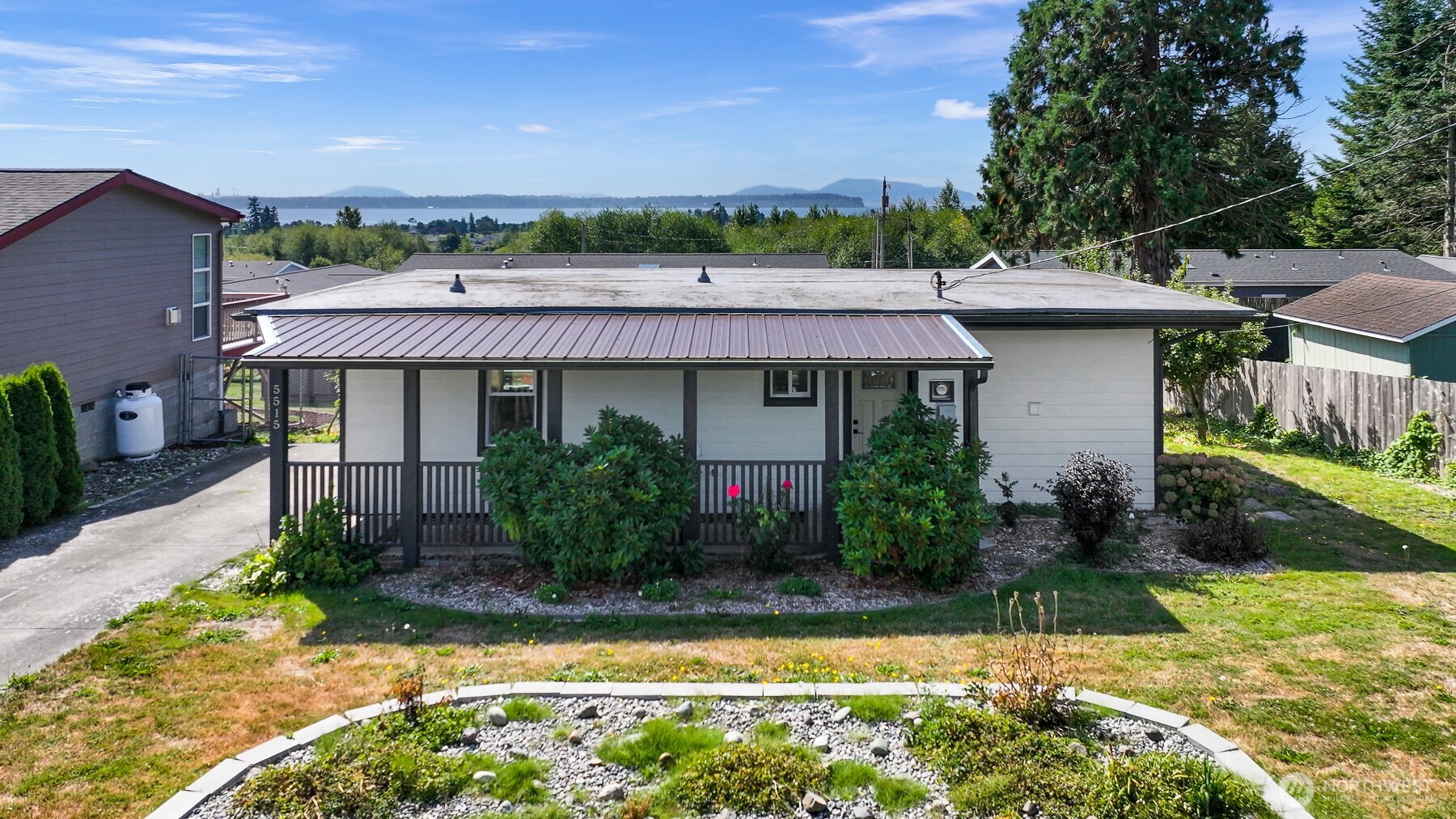 Fully renovated and move-in ready, this 2-bedroom, 2-bath Birch Bay home pairs water views with an easy-care coastal lifestyle. Thoughtfully updated throughout, the bright interior features a modern kitchen with white shaker cabinetry, quartz countertops, and generous pantry storage; luxury vinyl plank flooring; energy-efficient LED lighting; fresh interior and exterior paint; and a newer mini-split for year-round heating and cooling. Improvements include an added 3/4 bath, adding valuable flexibility to this efficient 790-sq-ft home. Step onto the back deck, take in the water views, and enjoy a mostly fenced 7,408-sq-ft yard with mature fruit trees and space to garden, relax, or entertain. An attached storage room keeps bikes, beach gear, and tools close at hand, while off-street parking, city water and sewer, and a low annual HOA add everyday convenience. Here, life can move at a different pace: morning coffee with a view, afternoons exploring the shoreline, and evenings unwinding at home. Just minutes from Birch Bay beaches, Birch Bay State Park, walking trails, Semiahmoo Resort and Golf Course, and year-round recreation, this location makes it easy to enjoy the best of coastal Whatcom County. An inviting coastal retreat with modern comforts, outdoor space, and the freedom of a detached home—all close to the bay. Owner-financing option available to qualified buyers. Come experience the home, the views, and the Birch Bay lifestyle.