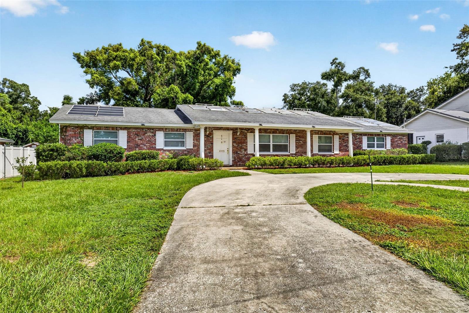 This sprawling 3-bedroom ranch offers a beautiful traditional floor plan with spacious living areas and thoughtful separation between the main living spaces and bedrooms.At the front of the home, the living and dining rooms create a welcoming, open space filled with beautiful natural light. The kitchen flows into a cozy family room featuring a wood-burning fireplace and convenient access to the backyard and screened-in porch.The large bonus room is designed for family entertainment and serves as an ideal media room. Enjoy game nights, movie nights, and more with the large-screen projector.The bedrooms are conveniently located on the west side of the home, tucked away from the main living spaces for added privacy.Outside, the spacious backyard provides plenty of room for family play, entertaining, and barbecuing with friends. A large 14’ x 12’ work shed offers additional storage or workspace and is equipped with solar power and air conditioning.Additional features include a 2017 roof, hardwood floors throughout the main living areas, and carpet replaced in 2026. The largest windows are impact-rated, with additional impact windows in the media room and office.The yard also features multiple mature and maturing lime and orange trees, adding to the home’s outdoor appeal. Residents can enjoy the community pool without the maintenance and expense of owning a private pool.Located in an established Brandon neighborhood, 614 N Sylvan Dr offers easy access to I-75, the Selmon Expressway, and major Tampa-area roadways. Everyday shopping, dining, groceries, and services are just minutes away, while nearby parks and recreational opportunities make it easy to enjoy the outdoors. For frequent travelers, Tampa International Airport is easily accessible via the major highway network, making this a convenient home base for exploring Brandon and the greater Tampa Bay area.