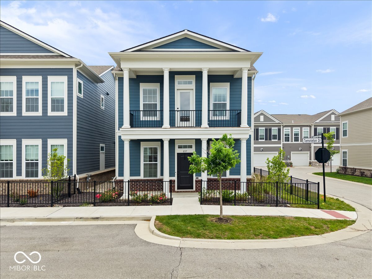 Located just minutes from downtown Carmel & surrounded by some of the best dining, shopping, & entertainment, this meticulously maintained home stands out with its high-end finishes, & move-in-ready condition. Situated on a premium corner lot, this beautifully appointed 3-bedroom, 2.5-bath home offers thoughtful upgrades throughout. The bright, open main level features 9 ft ceilings, luxury laminate flooring, Calacatta quartz countertops, ceiling-height cabinetry, a custom wood range hood, designer lighting, & a large walk-in pantry. Fresh paint throughout provides a crisp, polished feel. Upstairs, 9 ft ceilings continue throughout the entire second level, while high-end flooring extends through the stairway, loft, & primary bedroom, creating a cohesive, upscale feel. The spacious primary suite features a tray ceiling, designer lighting & window treatments, & a private balcony-perfect for enjoying your morning coffee or unwinding at the end of the day. Two addt'l nice-sized bedrooms, an upstairs laundry room, & an updated hall bath provide everyday comfort & convenience. The versatile loft offers the perfect space for a home office, reading nook, homework station, or cozy sitting area. Situated on a desirable corner lot, the home offers added privacy & more open views than many neighboring homes. Enjoy the fenced patio, ideal for relaxing, entertaining, grilling, or accommodating pets. Addt'l features include an energy efficient, dual-zone HVAC system, water softener, & the peace of mind that comes w/ a nearly new home. Enjoy access to community amenities including a pool, walking paths, & a highly desirable location minutes from downtown Carmel. W/ exciting new upscale residential, retail, dining, & green space developments underway nearby, the area continues to grow and thrive. It's hard to find this level of finish, amenities, & Carmel location at this price point. Meticulously maintained & truly turnkey, this exceptional Carmel house is ready for its next owner.