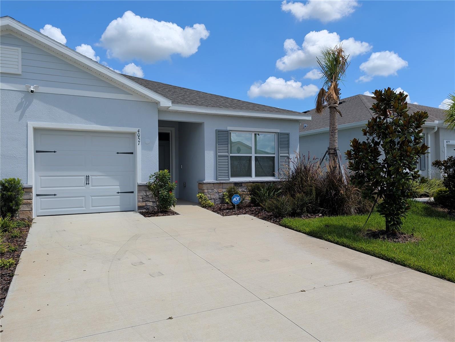 Welcome to Farm at Varrea! Conveniently located less than 10 minutes from I-4, 10 minutes to historic downtown Plant City, and within an easy commute to Tampa, Orlando, and Lakeland, this stunning D.R. Horton, villa style home is less than a year old and is constructed of concrete block with a stucco exterior. It offers three large bedrooms, and two full bathrooms. The kitchen is equipped with spacious, solid quartz countertops and ample cabinets for storage. The large great room accommodates a dining table while still providing plenty of space to serve as a comfortable place to relax after a long day. The community offers multiple amenities to include: a clubhouse with fitness center, a playground, basketball court, community pool, and extensive areas for walking and running. If you're looking for a quiet, easily accessible, and low-maintenance place to live, this just might be what you're looking for. Farm at Varrea is a CDD community. Fees cover grounds care and maintenance of the villa.