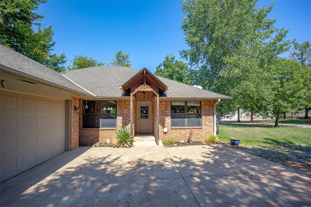 RARE OPPORTUNITY! This 2.3-ACRE property offers a unique combination of SPACE, PRIVACY, and FLEXIBILITY with a LARGE SHOP featuring a FULLY FINISHED APARTMENT, perfect for MULTI-GENERATIONAL LIVING, GUEST QUARTERS, or potential RENTAL INCOME! Conveniently located with EASY ACCESS TO ALL OKC HAS TO OFFER, the main home features 3 BEDROOMS, 2 BATHS, and a welcoming kitchen with GRANITE COUNTERTOPS, STAINLESS STEEL APPLIANCES, and a LARGE PANTRY. Step inside to ENGINEERED HARDWOOD FLOORS and a spacious family room highlighted by a FREE-STANDING WOOD-BURNING STOVE that can nearly heat the entire home during the colder months. The inviting PRIMARY SUITE offers a LARGE WALK-IN CLOSET, while the PRIMARY BATH features a WHIRLPOOL TUB and SEPARATE SHOWER. A 2-CAR GARAGE and HVAC SYSTEM ONLY 2 YEARS OLD add even more value. The impressive 40' X 50' SHOP includes an approximately 630 SQ FT APARTMENT with a LIVING ROOM, FULL KITCHEN, UTILITY AREA WITH WASHER/DRYER SPACE, BEDROOM, BATHROOM, and CLOSET—providing incredible versatility for extended living, guests, a home business, or additional income potential. Need more parking? You’ve got it! ADDITIONAL CARPORT SPACE provides room for BOATS, CAMPERS, EXTRA VEHICLES, or recreational toys, while the LARGE CIRCLE DRIVE makes coming and going easy. With NO HOA, a 6-FOOT COMMERCIAL-GRADE CHAIN-LINK FENCE and GATED ENTRY, plus MATURE TREES creating a PRIVATE SETTING, this property offers the rare SPACE, STORAGE, and VERSATILITY that is increasingly hard to find!