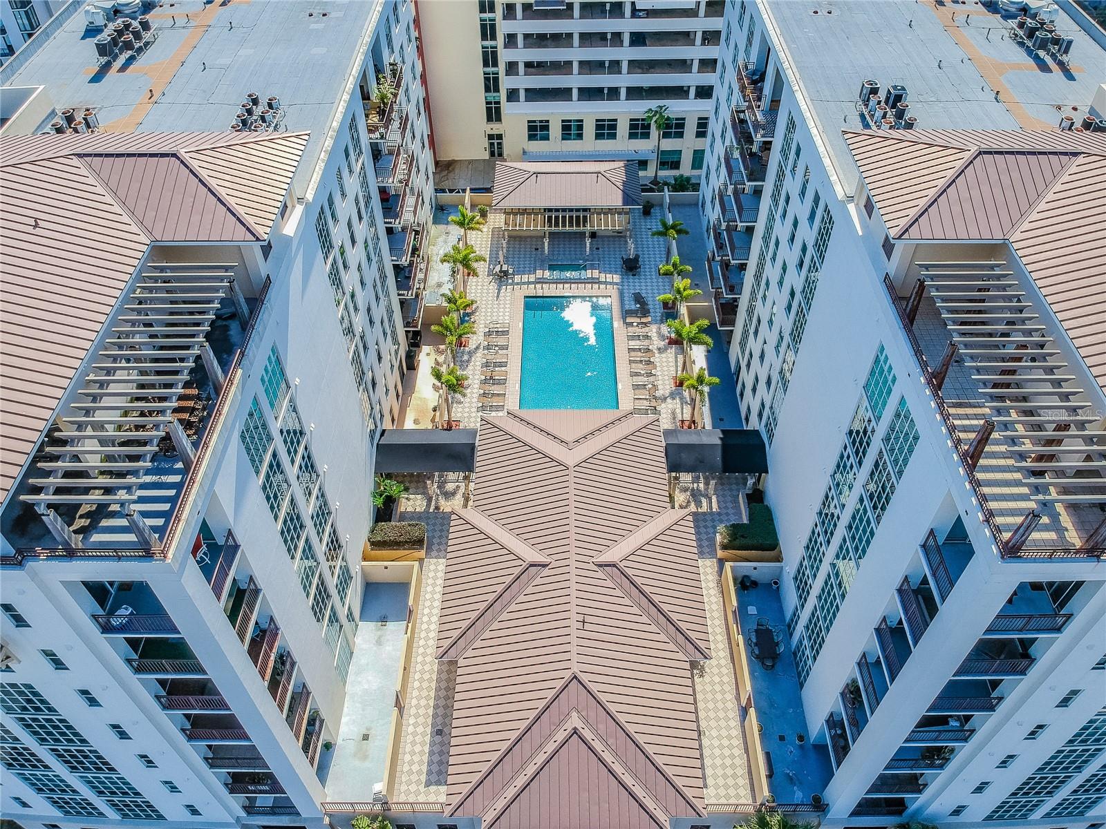 CHANNELSIDE CONDO | COVERED 9x15 TERRACE | PEEKABOO RIVER VIEWS | WALK TO WATER STREET | 2 PARKING SPACES | STORAGE UNIT | PET FRIENDLY | ASSESSMENT PAID                                                                Yes, from morning coffee on the terrace to evening walks along the waterfront to dinner at Water Street, this home offers the best of Tampa’s urban lifestyle. Take advantage of this rare opportunity to own a 2-bedroom split floor plan condo in the heart of Channelside, just steps from Water Street, Sparkman Wharf, and Amalie Arena. The building is pet-friendly and allows up to two pets per unit with no size limit, making it ideal for dog owners seeking walkable city living.Enjoy a covered 9x15 private terrace with peekaboo views of the river and passing cruise ships, creating a relaxing outdoor space rarely found in urban condo living.Inside, the home features engineered hardwood flooring, wood cabinetry, granite countertops, and a bright open layout designed for comfortable living. Numerous windows and sliding glass doors fill the space with natural light, complemented by plantation shutters throughout. A **dedicated dining area—rare in condo living—**adds flexibility for both everyday living and entertaining.The split-bedroom floor plan provides excellent privacy. The spacious primary suite offers a walk-in closet and direct terrace access, while the primary bath includes a soaking tub and oversized separate shower.A true in-unit laundry room with additional cabinetry adds valuable storage and convenience.Additional highlights include a high-efficiency Daikin AC system, two garage parking spaces, private storage unit, and a major exterior assessment already paid in full, offering peace of mind and long-term value.Located in the vibrant Channelside District, you’re moments from Tampa’s best dining, entertainment, waterfront parks, and nightlife in one of the city’s most walkable urban neighborhoods. With two parking spaces, a private terrace, in-unit laundry room, and a pet-friendly building with no weight limits, this home offers a combination of features rarely found together in Channelside condo living.