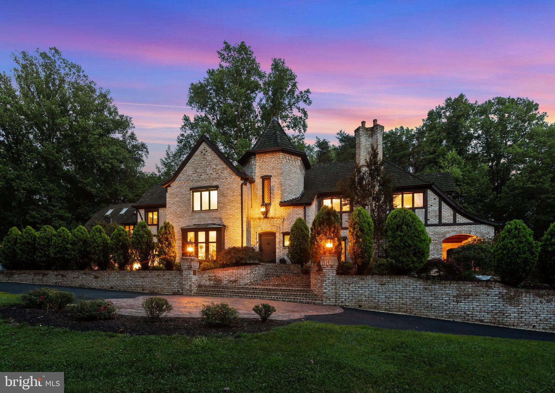 CastlewoodWhere History Was Made. Where Legends Live On.Some homes are built. Castlewood was composed — a French Normandy manor conceived as a work of art and executed by hands of extraordinary skill, standing sentinel on nearly two private acres and bordering almost seven acres of untouched Cedar Run woodland. This is not simply real estate. This is provenance.An Icon, From the Ground UpAt up to nearly 10,000 meticulously crafted square feet, Castlewood is engineered like a fortress and finished like a treasure. Structural steel I-beams form its bones, wrapped in the masterful brickwork of Archie Holleman and adorned with the legendary ironwork of Danny Hurwitz — the same hands entrusted with restoring the gates of the White House.Enter through a 200-pound hand-carved oak door and step into a soaring, 40-foot tower foyer that takes your breath away. A grand staircase worthy of Gone with the Wind rises before you, while above, a rare Romeo-and-Juliet balcony frames an authentic coat of arms dated circa 1629 — a piece of history that predates the founding of this nation.Hand-hewn woodwork and 250-year-old yellow pine floors run throughout, lending every room the warmth and romance of classic English architecture, while soaring proportions and thoughtfully designed living spaces make Castlewood as effortless to entertain in as it is extraordinary to behold.Pass through 9-foot antique church pocket doors into a bespoke executive library — hand-crafted entirely from a single, select cherry tree, its mantel a walnut match to the storied Georgetown Club.Elite Amenities, Elevated LivingThe kitchen is a chef's dream: rich marble counters, custom cherry cabinetry, and antique brick accents that whisper old-world charm while delivering every modern convenience.Descend the spiral staircase into a wine cellar unlike any other on earth — its brick floor reclaimed from the very Gettysburg sidewalk where Abraham Lincoln once delivered his address. Few homes offer a wine cellar. None offer this one.Upstairs, retreat to a sprawling primary suite sanctuary complete with a fireplace, dual bathrooms, and a body-massage jet shower with heated seat — a private spa built for daily indulgence. Additional lifestyle amenities include:A billiard room/art studio beneath soaring high-beamed ceilingsAn authentic Finnish sauna, custom-built from South African woodA multi-zone radiant heat system for year-round comfortBotanical Perfection, Just Beyond Your DoorStep outside and the artistry continues. Professionally curated grounds unfold like a living masterpiece — a handmade brick veranda overlooking a breathtaking botanical sanctuary of 16 magnificent Japanese maples, a flourishing persimmon tree, elegant camellias, and vibrant seasonal blooms, all flowing gracefully into dedicated organic kitchen gardens.Beyond your private oasis, the lifestyle continues: community tennis and pickleball courts, and access to miles of running, walking, and biking trails along the Washington & Old Dominion Trail.Live Where History Was Made. Love Where You Live.Castlewood is not a house you decide to buy — it's a legacy to become part of. Homes of this caliber, craftsmanship, and story do not come to market twice in a lifetime.Schedule your private tour today.