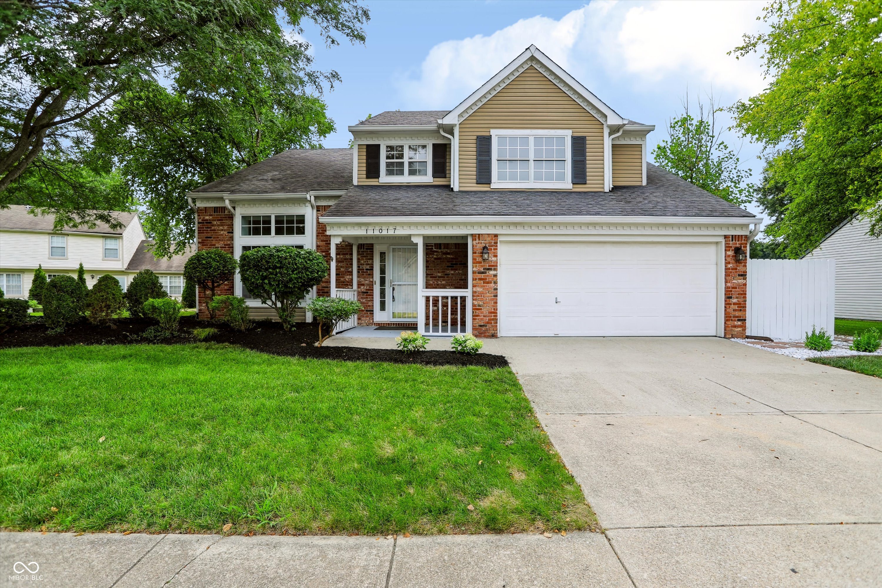 Welcome home to this beautifully updated 4-bedroom, 2.5-bath home in the highly sought-after Gatewood neighborhood of Fishers! Ideally located just minutes from top-rated Hamilton Southeastern Schools, shopping, dining, parks, and easy interstate access, this home offers the perfect combination of location, style, and functionality.  A vaulted foyer filled with natural light leads directly into a bright, inviting formal living room lined with large windows.  The open main Level features an elegant formal dining room and a bright kitchen nook bathed in sunlight, offering picturesque views of the outdoors.  Brand-new custom kitchen cabinets, sleek new quartz countertops, a generous central island, and new stainless-steel appliances-all framed by sunny backyard views.  All four bedrooms are located upstairs, including a spacious primary suite with a vaulted ceiling, walk-in closet, and private bath featuring a double-sink vanity. Three additional bedrooms provide plenty of space for family, guests, or a home office. Step out from your kitchen area onto a custom paver patio with a built-in firepit, surrounded by professional landscaping and natural privacy. Don't miss your opportunity to make this beautifully updated home your own.