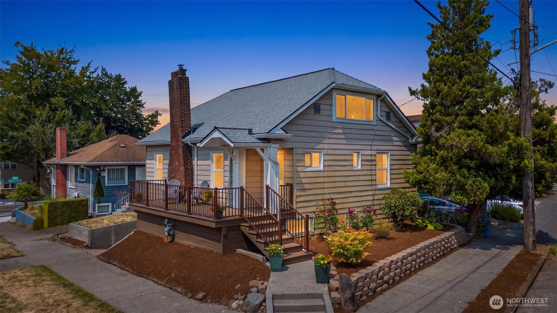 Don't miss this delightful Craftsman perfectly located on a corner lot in the heart of Seattle's desirable Beacon Hill, close to wonderful neighborhood amenities and Jefferson Park. This beautifully maintained 1,950-square-foot residence delights with timeless vintage character, offering 3 bedrooms, 1 full bathroom, and wonderful flexible potential. Inside, the home shines with brand-new interior paint and new carpeting, highlighting gorgeous original wood millwork, classic glass doorknobs, and stunning refinished hardwood floors. Plan to easily host dinners in the formal dining space, where large windows flood the main living areas with abundant natural light. The main level provides a lovely primary bedroom and a large full bathroom for easy accessibility, while the upper level provides two cozy, attic-style bedrooms. Downstairs, discover untapped potential with one large, finished bonus room, a dedicated laundry area, generous storage space, and a convenient attached one-car garage. Outside, picture summer evenings relaxing on the low-maintenance deck, enjoying the outdoor space and watching the vibrant neighborhood stroll by. Explore future uses with NC1P-55 (M) zoning. Best of all, this prime location offers an unbeatable urban lifestyle, situated just a short walk from the LINK light rail station, local restaurants, and major regional commuting routes.