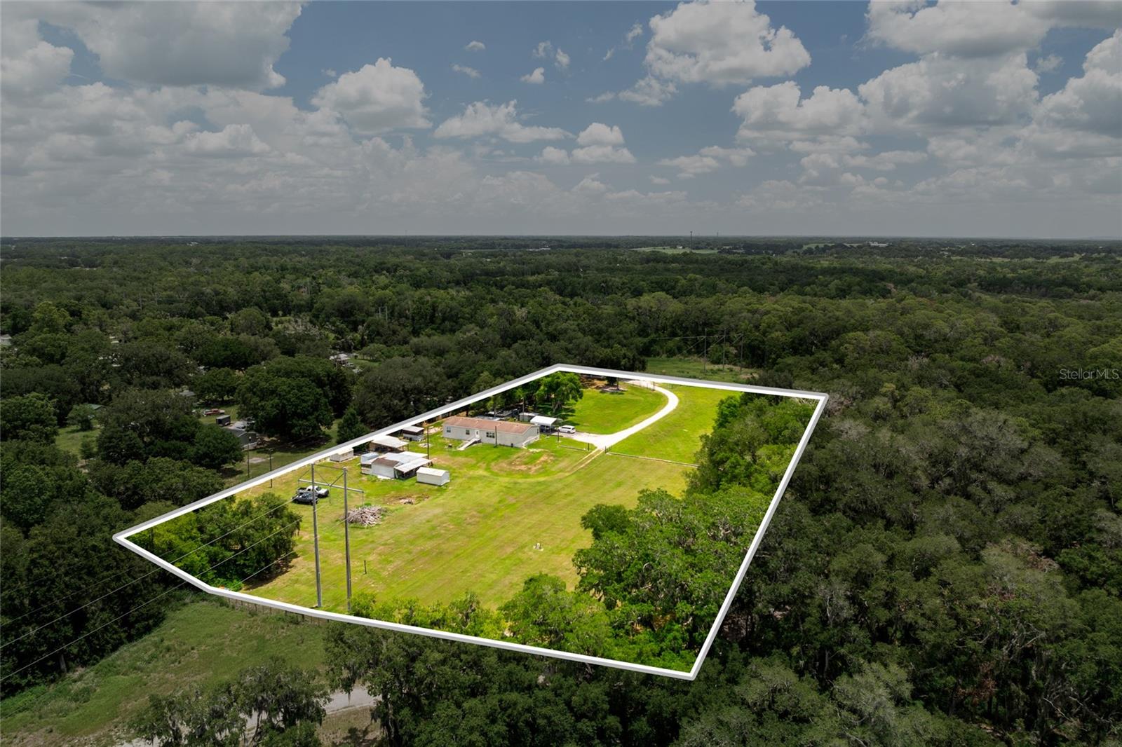 Looking for room to spread out? This nearly 5-acre property offers a rare opportunity in Plant City's rural countryside with agricultural zoning, no HOA, and no deed restrictions. Whether you're dreaming of a small farm, bringing your animals, building your future home, or simply enjoying the privacy and open space, the possibilities are endless.The property includes an existing manufactured home that conveys as-is, along with a private well and septic system. Surrounded by peaceful countryside and backing up to protected land, you'll enjoy added privacy while still being conveniently located near major roadways, shopping, dining, and everything Plant City has to offer.Bring your vision and make this unique property your own. Buyers are encouraged to verify zoning, permitted uses, and future development opportunities with Hillsborough County.