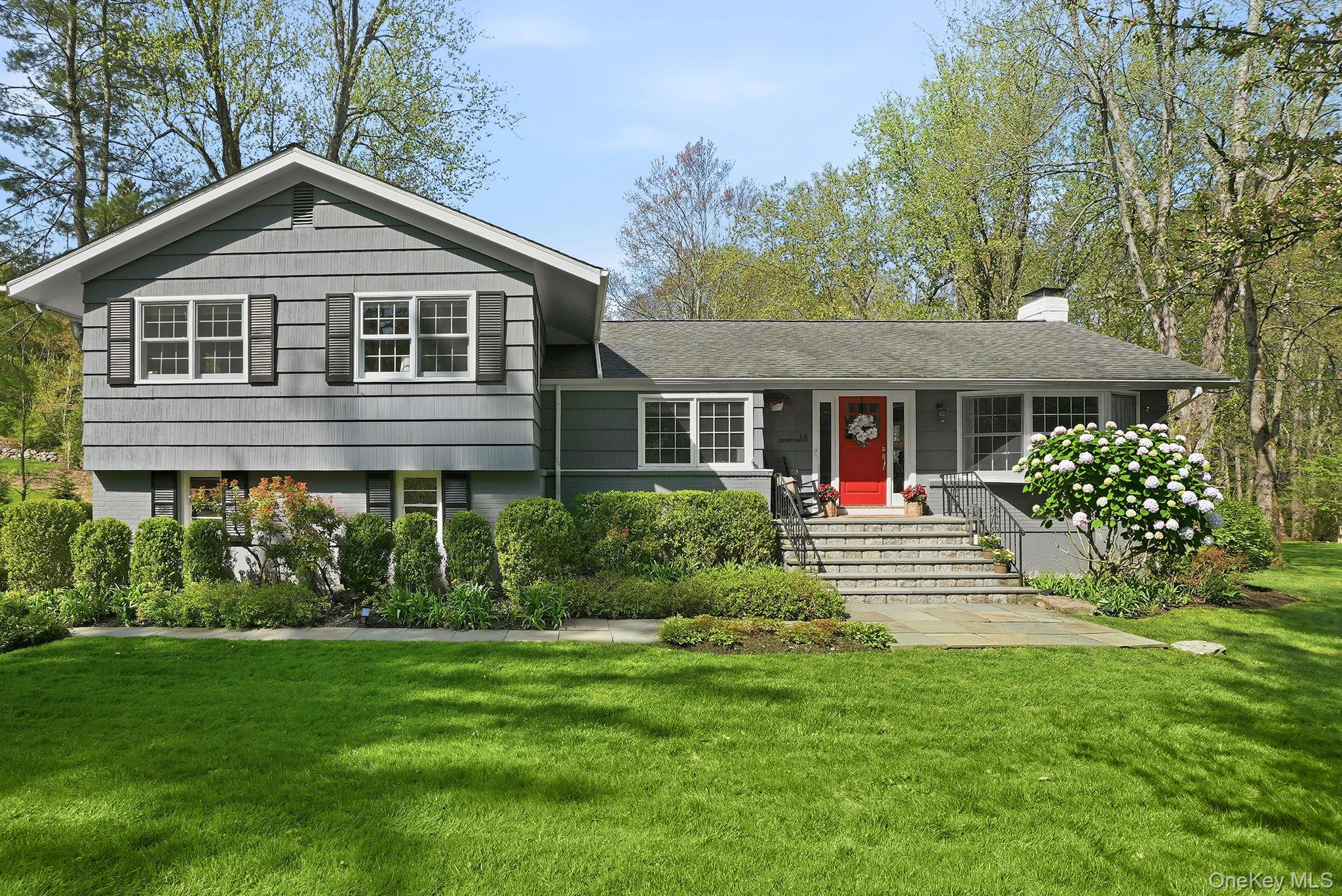 Completely reimagined and move-in ready, this sun-filled 3-bedroom plus home office, 2.5-bath home sits on over one acre of rare, level property in one of Chappaqua’s most sought-after neighborhoods. Blending modern updates with timeless design, the home offers a bright, open flow ideal for today’s lifestyle, with expansive windows that flood every room with natural light.The main level showcases an expansive living room with a newly added gas fireplace and dual picture windows, a dedicated home office ideal for remote work, and a beautifully updated eat-in kitchen that flows seamlessly into an open-concept dining room —perfect for everyday living and entertaining. Step outside to a large deck overlooking the private, flat backyard, offering exceptional indoor-outdoor living. Just off the kitchen, a half-flight of stairs leads to a versatile ground level bonus room with picture windows, windowed powder room, and conveniently located mudroom with direct access to the attached two-car garage—ideal for everyday convenience. The second level, features a generous primary suite with a walk-in closet and en-suite bath, along with two additional spacious bedrooms and a full hall bathroom. The expansive lower level provides additional flexible living space, including a recreation room a windowed laundry room along with ample storage space.Set on meticulously maintained, park-like grounds with mature plantings, this property offers the perfect combination of tranquility and convenience. Just minutes to downtown Chappaqua, schools, train, Gedney Park, shopping, and dining!