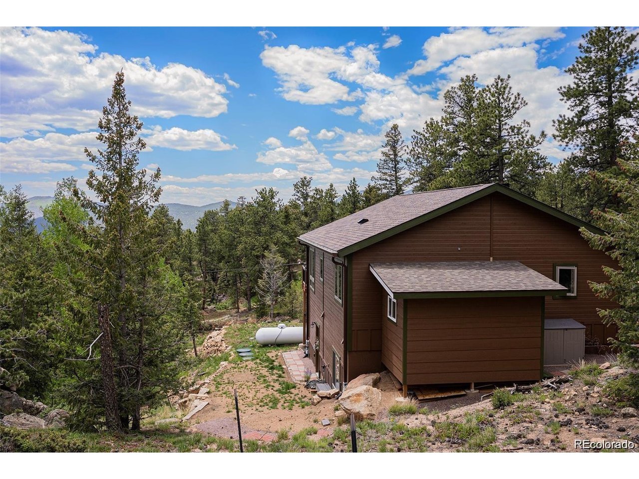 This isn't just a home-it's a lifestyle. A rare opportunity to own a stunning, nearly new mountain retreat that offers everything you've been searching for: privacy, beauty, quality, and unbeatable access to the great outdoors. Expertly built just two years ago by one of Estes Park's most respected and experienced builders, this home was designed with intention and crafted with care. Set on 1.2 acres and backing directly onto protected National Forest, your backyard becomes a gateway to adventure. Step out of your door and onto endless hiking trails. Watch elk graze, wild turkeys wander, and eagles soar-all from the comfort of your own private haven. Inside, every detail has been carefully curated for comfort and efficiency. High-efficiency Andersen heat-lock windows flood the home with natural light while keeping energy bills low. Enjoy the ease of soft-close kitchen cabinets, the beauty of an oak staircase, and the peace of mind that comes with a hybrid electric water heater and a high-efficiency furnace. Stay cozy year-round with a wood-burning fireplace that brings warmth and charm to chilly mountain evenings. Fiberglass exterior doors add both durability and energy efficiency. Just minutes from downtown Estes Park, you'll enjoy the best of both worlds-secluded mountain living with convenient access to shops, dining, and community amenities. Don't miss this rare opportunity to own a piece of Rocky Mountain paradise. Schedule your private tour today!