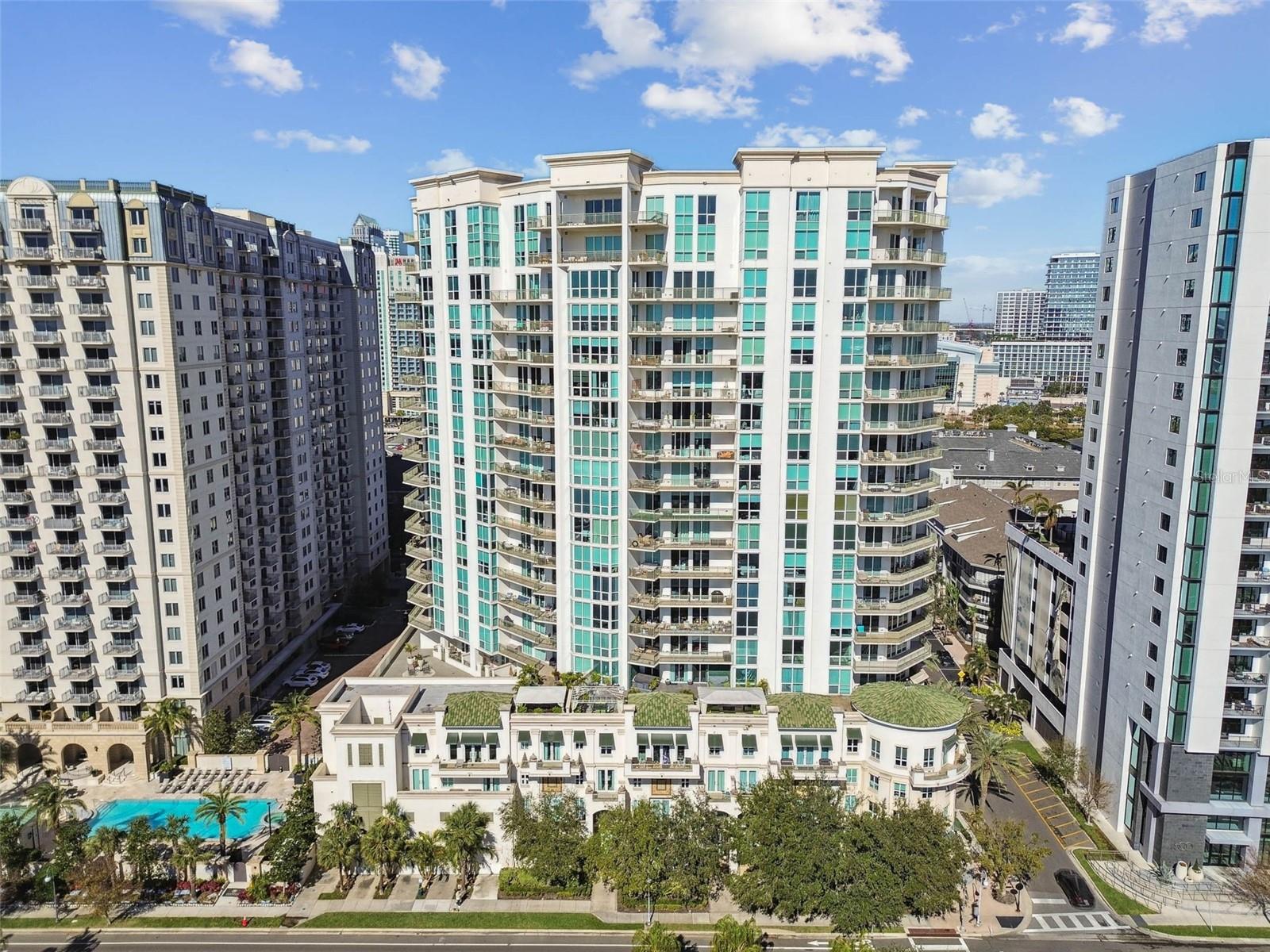 One or more photo(s) has been virtually staged. Fabulous opportunity to purchase a 2-bedroom unit at The Plaza, one of the most preeminent buildings in all of Tampa, located on Harbour Island, consistently named one of the top places to live in the U.S. This 2 bedroom-2 bathroom (or 1 bedroom and den/office) unit features an open floor plan, bamboo hardwood floors, and stunning northeast views of the Water Street district, Benchmark International Arena (formerly known as Amalie Arena), the Channel District, and cruise terminals.   Watch the cruise ships come and go and enjoy the fireworks several times a year over Sparkman Wharf. The kitchen has granite counters, 42” wood cabinets with crown detail , custom backsplash, a breakfast bar, and stainless-steel appliances. The open floor plan features a large living area and dining area with access to the unit-wide verandah.  The owners’ suite boasts a large bedroom with access out to the balcony, en suite bathroom with double vanity and undermount sinks, granite countertop, soaking tub, walk-in shower, and a custom walk-in closet. The second bedroom could easily accommodate a Murphy bed and do double duty as a home office, and there is an adjacent full bathroom including an upgraded vanity with granite counter. The dedicated laundry room includes additional storage space; the washer and dryer convey with the unit. The amenities at The Plaza are unparalleled: resort-style infinity edge heated pool and spa, valet parking, 24-hour front desk coverage: full-time on-site staff: concierge, property manager and assistant property manager, building engineer and his assistants; two community rooms, fully outfitted wellness center, spa room with massage table, sauna, business center, two conference rooms, and 4 EV chargers. All interior and exterior common areas have undergone a recent renovation. Harbour Island offers walking distance to shops, restaurants, the Tampa Riverwalk, Sparkman Wharf and the Water Street district. Take advantage of convenient access to downtown Tampa and St. Pete, all major roads, interstates, and TIA. Buyer to make a one-time contribution of 0.2% of the purchase price to the Plaza capital reserve fund at closing.