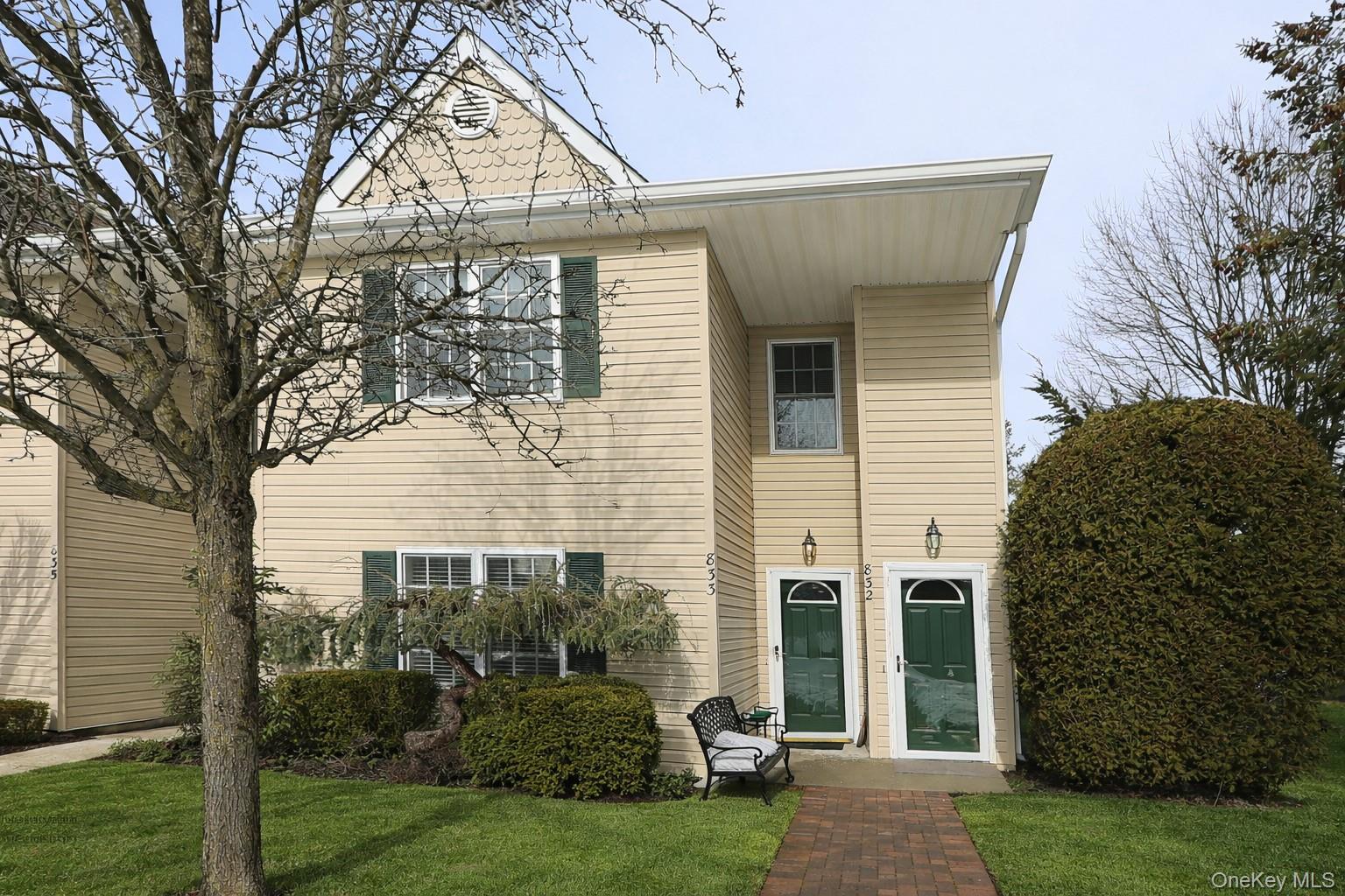 Bright Renovated Corner END Unit! Every detail was thoughtfully designed from the moment you walk into this beautifully updated 2-bedroom, 2-FULL bath LOWER Caspian model located in the highly sought-after Greens at Half Hollow (55+ community). This sun-filled corner unit features recessed lighting, and a private patio backing a lush landscaping. The updated kitchen is the heart of the home, showcasing an extended granite countertop. The spacious primary suite offers a walk-in closet and an elegant en suite bath, while the guest bedroom/den with a full bath provides extra space. END UNIT provides additional windows and light. Enjoy resort-style living at The Greens with a 24-hour attended gatehouse, regular security patrols, and a vibrant clubhouse featuring an indoor/outdoor pool, gym, spa, sauna, steam room, card room, restaurant, and library. Take part in group activities, tennis, and walking trails, with access to an optional 18-hole golf course and on-site restaurant with no minimum. Appearance: Diamond+++