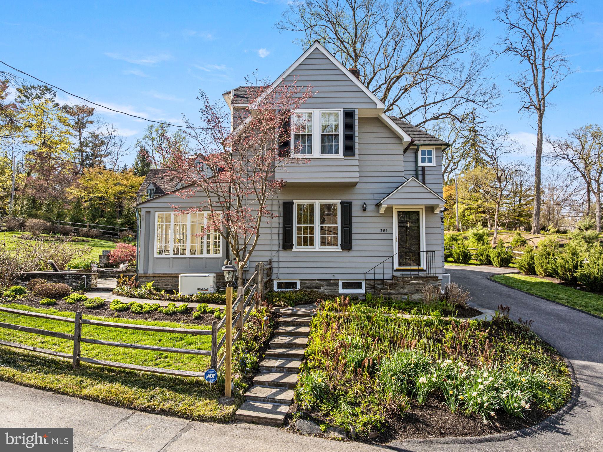Welcome to this splendid treasure in coveted Northside Haverford, designed by renowned architect Frank Furness just prior to the turn of the century in 1895. This enchanting home in a lovely storybook setting was designed to capture the beautiful scenery while offering wonderful indoor and outdoor entertaining and living space with exceptional architectural details. The exterior is clad in authentic clapboard siding tastefully painted (June 2024) with triple hung true divided light windows, beautiful tiered slate courtyards with dry-stack stone walls, elegant gardens filled with perennials that pop throughout the year, an architectural shingle roof (December 2023) as well as a beautiful copper roof (December 2023) above the Garden/Sun Room, all copper downspouts and gutters, slate walkways, and the restored original garage doors for beautiful and authentic aesthetic. Pride of ownership shows in keeping with the original character of the home with modern amenities that suit today’s needs, including recently remodeled bathrooms, a whole house Generac generator (April 2024), updated electric as well as natural gas for heating and cooking. Other interior features include exquisite millwork, 10 foot ceilings on the first floor, hardwood floors throughout the home, Frank Furness signature keyhole stairwell and original bannister with ivory inlay, large fireside Living Room with a wall of built-ins, heated Garden/Sun Room with original hardware on windows and doors, formal Dining Room with swinging door to Breakfast Area with built-in banquette seating and updated granite Kitchen, and sprawling Family Room addition converted from the original garage with newer hardwood floors, a Powder Room, and French doors to the courtyards. The upstairs of the home has five functional bedrooms including a Primary Bedroom with en suite bath, two additional updated baths, and a convenient 2nd floor Laundry Room. The Lower Level of the home is unfinished, dry, and organized with a walk-out door to the driveway side of the home. The driveway has been repaved and has ample room for parking!  This convenient location is within walking distance to the Merion Cricket Club, Haverford train station, and shops at Haverford Square, within close proximity to all major roadways for commuting to Center City or the airport, nearby local schools, and within minutes to the towns of Bryn Mawr and Ardmore as well as Suburban Square for shopping and dining! Don’t miss this opportunity to have your own slice of heaven in one of the most sought after Main Line neighborhoods!