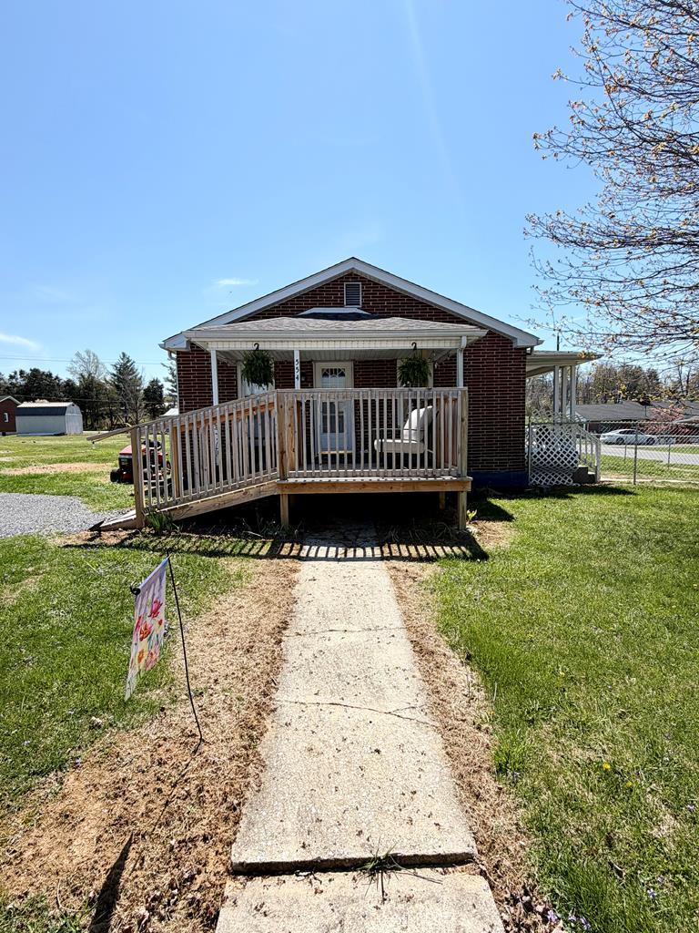 Welcome home to this beautifully updated, move-in ready 3 BR brick home! This charming property has had lots of updates to include refinished hardwood floors throughout and completely remodeled bathroom boasting a brand-new tub, shower, vanity, toilet, and stylish tile flooring as well as fresh paint throughout and sealed full unfinished basement. Step outside to enjoy the new side deck with handicap ramp—perfect for relaxing or entertaining. Brand-new chain link fence and a freshly regraded driveway with new gravel. Situated on a large, flat yard, this property is ideal for pets or kids and includes an outbuilding for extra storage or workspace. Located in a quiet, desirable neighborhood, you'll appreciate the easy access to I-81 and proximity to both Marion and Chilhowie—all with no town taxes! Don't miss this well-maintained home offering comfort, updates, and a fantastic location!