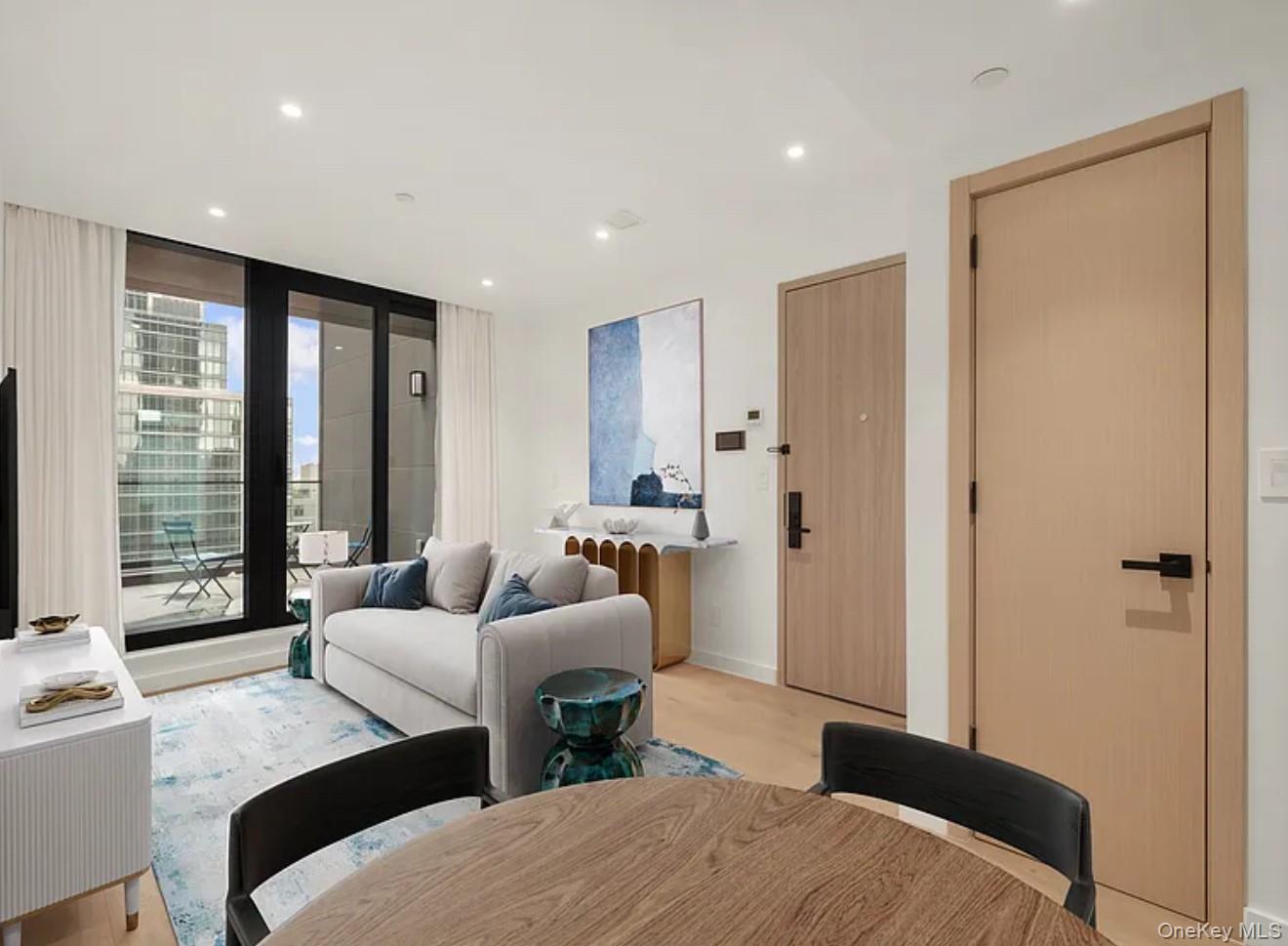 Welcome home to Unit 10A at 42-62 Hunter Street — a modern two-bedroom, two-bath condo with southeast exposure, stunning city views, and two private outdoor spaces (terrace & balcony). The open-concept living area features engineered hardwood floors, soft ambient lighting, and central heating & A/C throughout.The windowed kitchen offers quartz countertops and premium appliances, including a Blomberg refrigerator, Bertazzoni gas range, and dishwasher. Both bedrooms are generously sized with custom closets, complemented by spa-like bathrooms.Additional highlights include in-unit laundry, smart home features (keyless entry & smart thermostat), and access to a state-of-the-art fitness center on the same floor.Ideally located in Long Island City, just minutes from Manhattan, close to Michelin-rated dining, cafes, shops, Gantry Plaza State Park, Hunter’s Point South Park, multiple subway lines (E/F/M/N/R/G/7), and the NYC Ferry.Photos may be virtually staged. Brokers welcome. CYOF